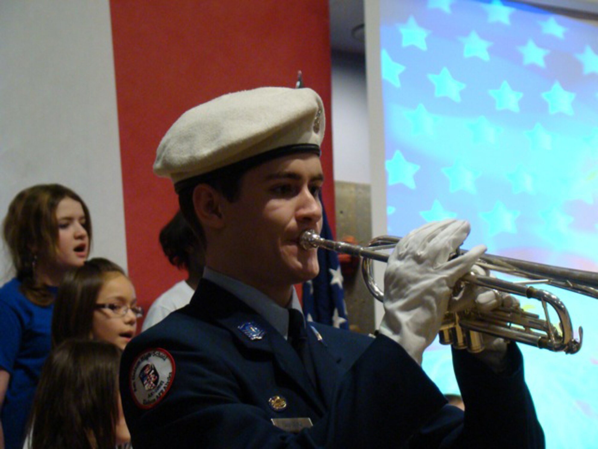 Cadet Master Sgt. Ryan Wussow performs as a guest artist with the Crawford Singers Nov. 11, 2009, Eielson Air Force Base, Alaska. In a separate tribute, he played Taps to honor those who have made the ultimate sacrifice in service to our country. Ryan is the son of Master Sgt. Michael Wussow of the 354th Maintenance Squadron. (Courtesy photo)