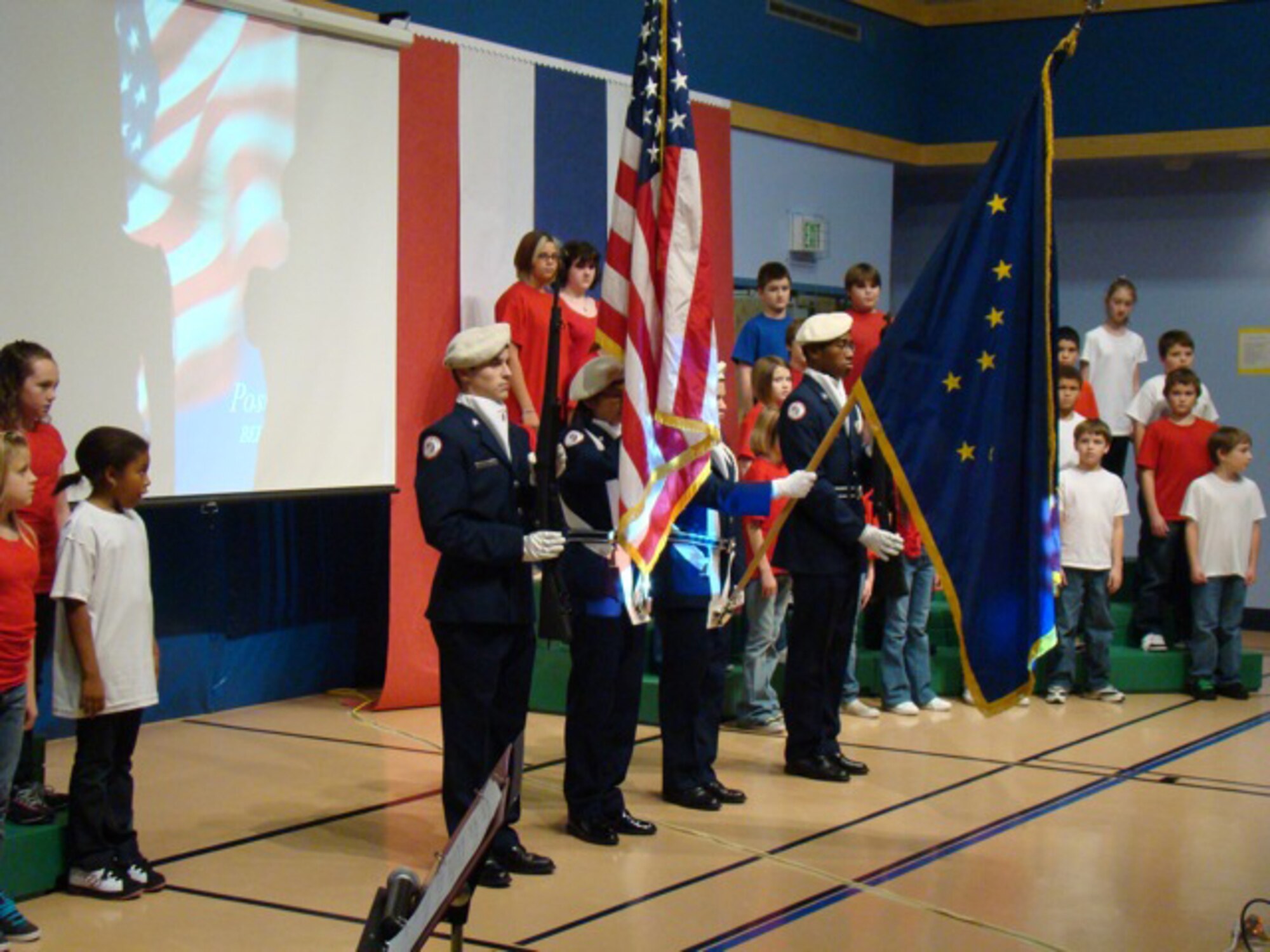Students from Ben Eielson High School Junior Reserve Officer Training Corps present the colors as The Crawford Singers prepare to honor American's Veterans on Nov. 11, 2009, Eielson Air Force Base, Alaska. (Courtesy photo)