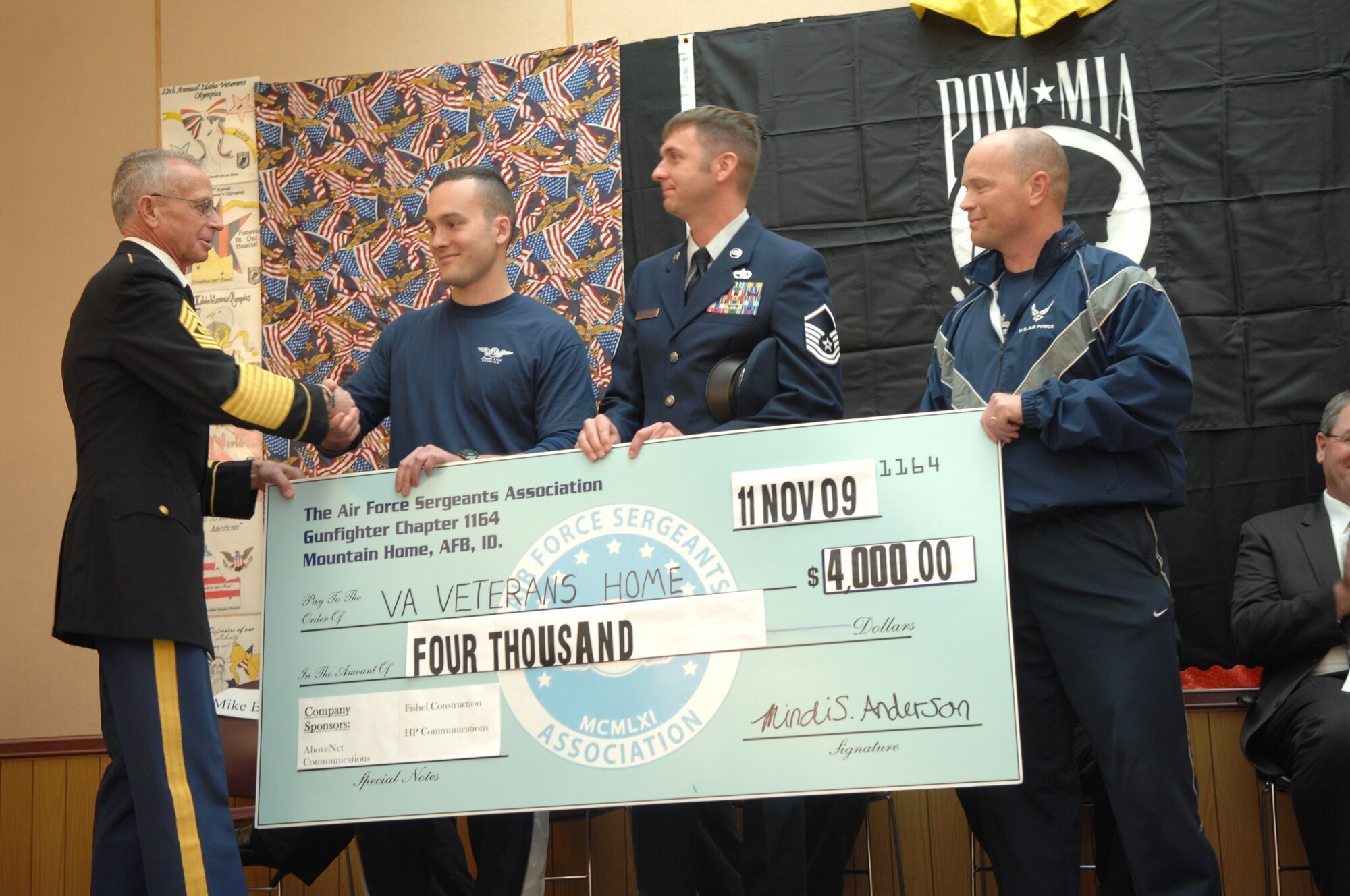 MOUNTAIN HOME AIR FORCE BASE, Idaho – Ret. Command Sgt .Maj. Phil Hawkins thanks Staff Sgt. Zachariah Fair, Master Sgt. Michael Shelley and Senior Master Sgt. Patrick Combs from the Air Force Sergeant Association for their $4,000 donation to the Idaho State Veterans Home. Over 50 runners travelled more than 250 miles on a nonstop 24 hour journey to raise money for the local ‘Beds for Vets’ program. (U.S. Air Force photo/ Captain Tracy Giles)