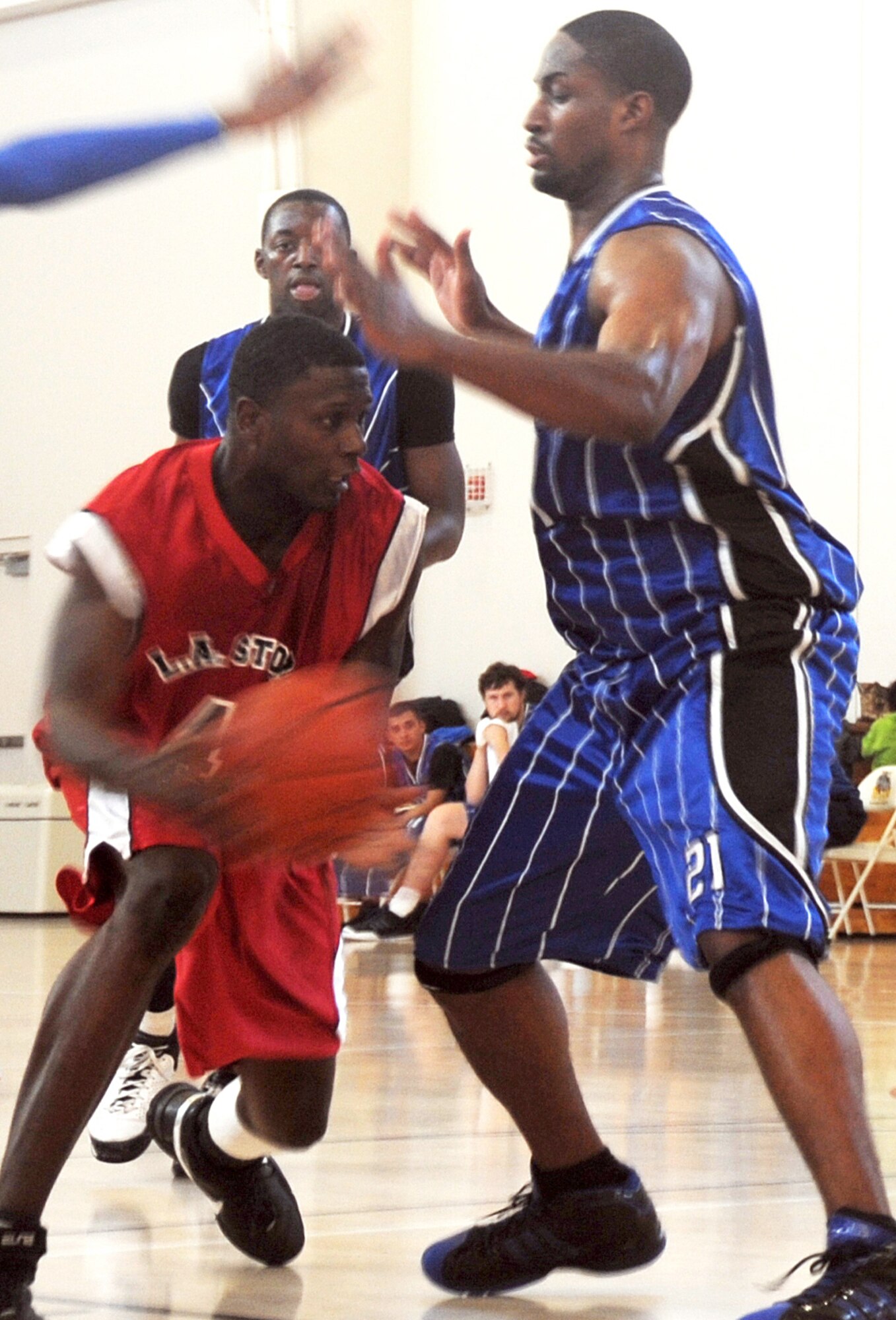 Airman First Class Caleb Chandler (left), 61st Medical Group, drives the lane against defenders from Travis Air Force Base during the championship final game. Los Angeles AFB sponsored the 2009 Veterans Day "SoCal Shootout" Basketball Tournament on Nov. 7 and 8, which included participation from Luke AFB, Travis AFB, Vandenberg AFB, and Edwards AFB. The LA Storm won the championship title with an 80 to 77 victory over Travis. (Photo by Atiba Copeland)