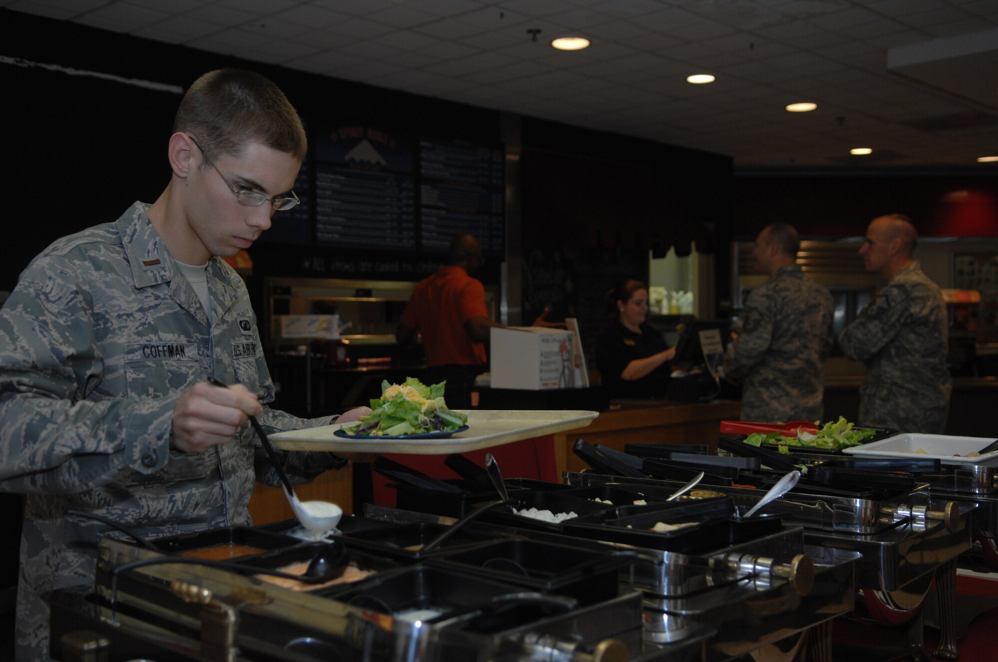 WHITEMAN AIR FORCE BASE Mo. – 2nd Lt. Benjamin Coffman, 509th Contracting Squadron member, enjoys the buffet offered at Missions End Nov  17.  Missions End offers a variety of catered events during large and small, from wedding receptions to Sweet 16 birthday parties and military functions such as Airmen Leadership School graduations.(U.S. Air Force Photo/ Senior Airman Jessica Mae Snow) (Released)