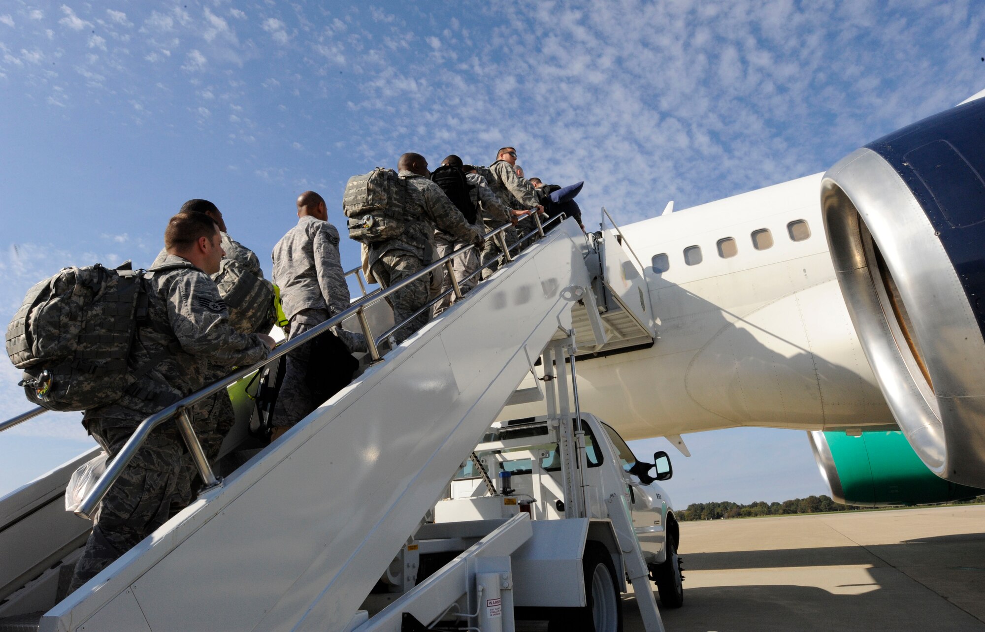 LANGLEY AIR FORCE BASE, Va. -- Team Langley members board a commercial aircraft Nov. 4 for a deployment to United Arab Emirates.  Six 1st Fighter Wing F-22A Raptors are participating in bilateral training with Coalition partners from Nov. 15 to Dec. 10. (U.S. Air Force Photo by/Senior Airman Dana Hill)