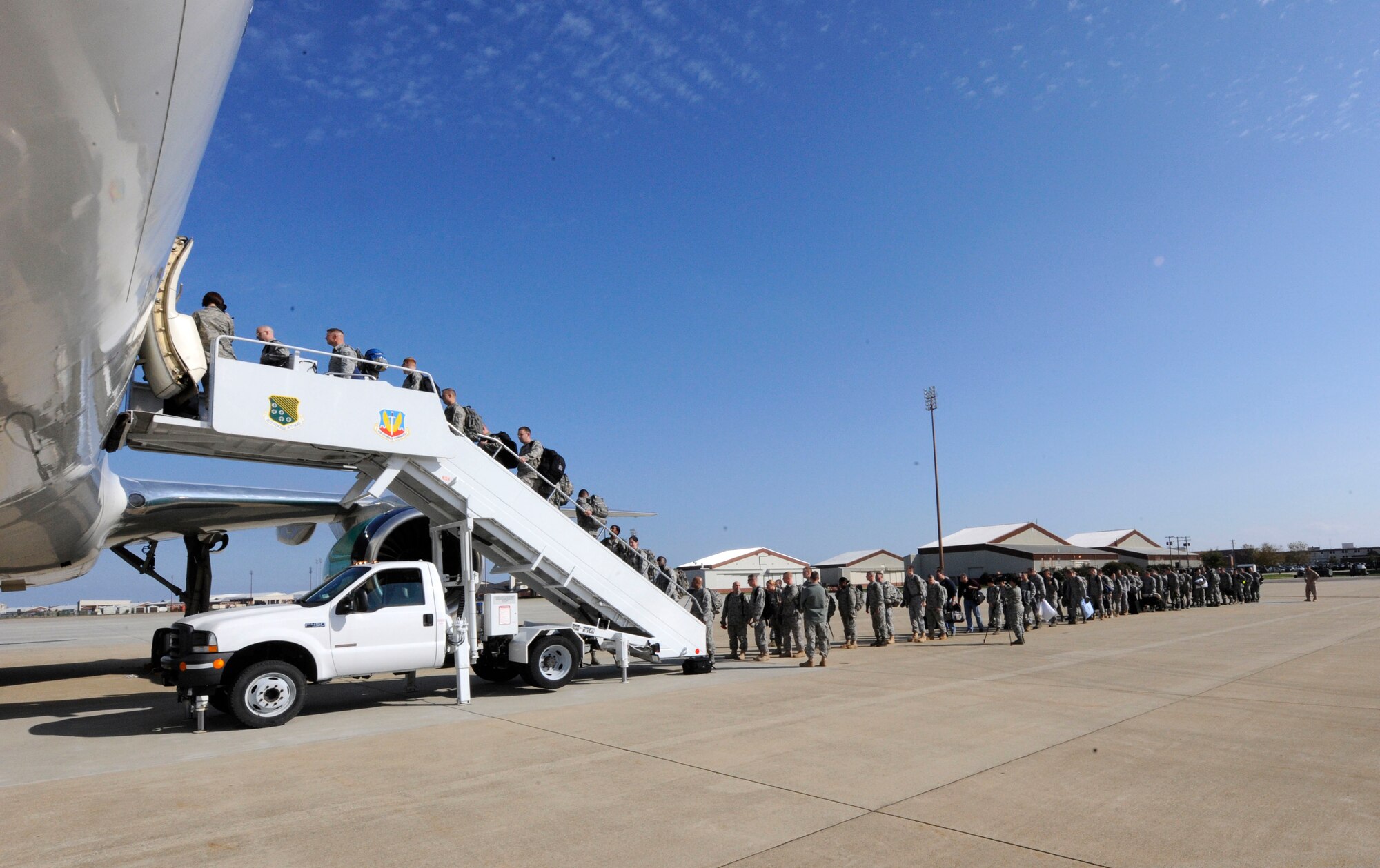 LANGLEY AIR FORCE BASE, Va. -- Team Langley members board a commercial aircraft Nov. 4 for a deployment to United Arab Emirates.  Six 1st Fighter Wing F-22A Raptors are participating in bilateral training with Coalition partners from Nov. 15 to Dec. 10. (U.S. Air Force Photo by/Senior Airman Dana Hill)
