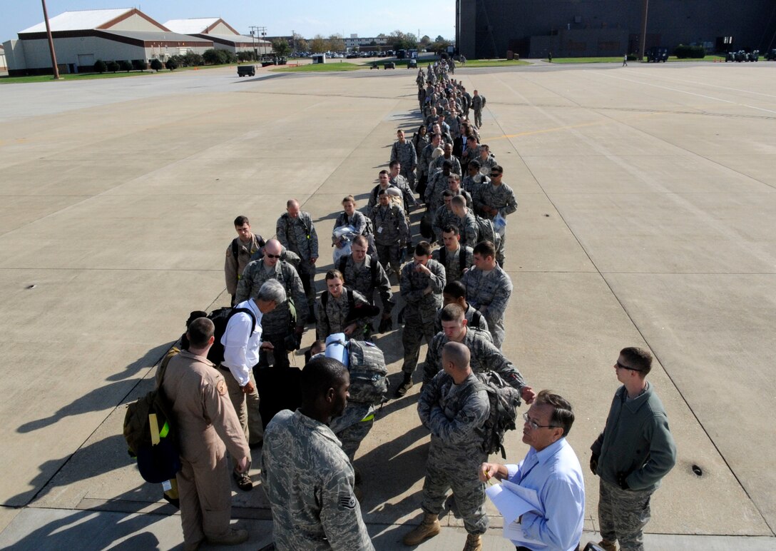 LANGLEY AIR FORCE BASE, Va. -- Team Langley members board a commercial aircraft Nov. 4 for a deployment to United Arab Emirates.  Six 1st Fighter Wing F-22A Raptors are participating in bilateral training with Coalition partners from Nov. 15 to Dec. 10. (U.S. Air Force Photo by/Senior Airman Dana Hill)