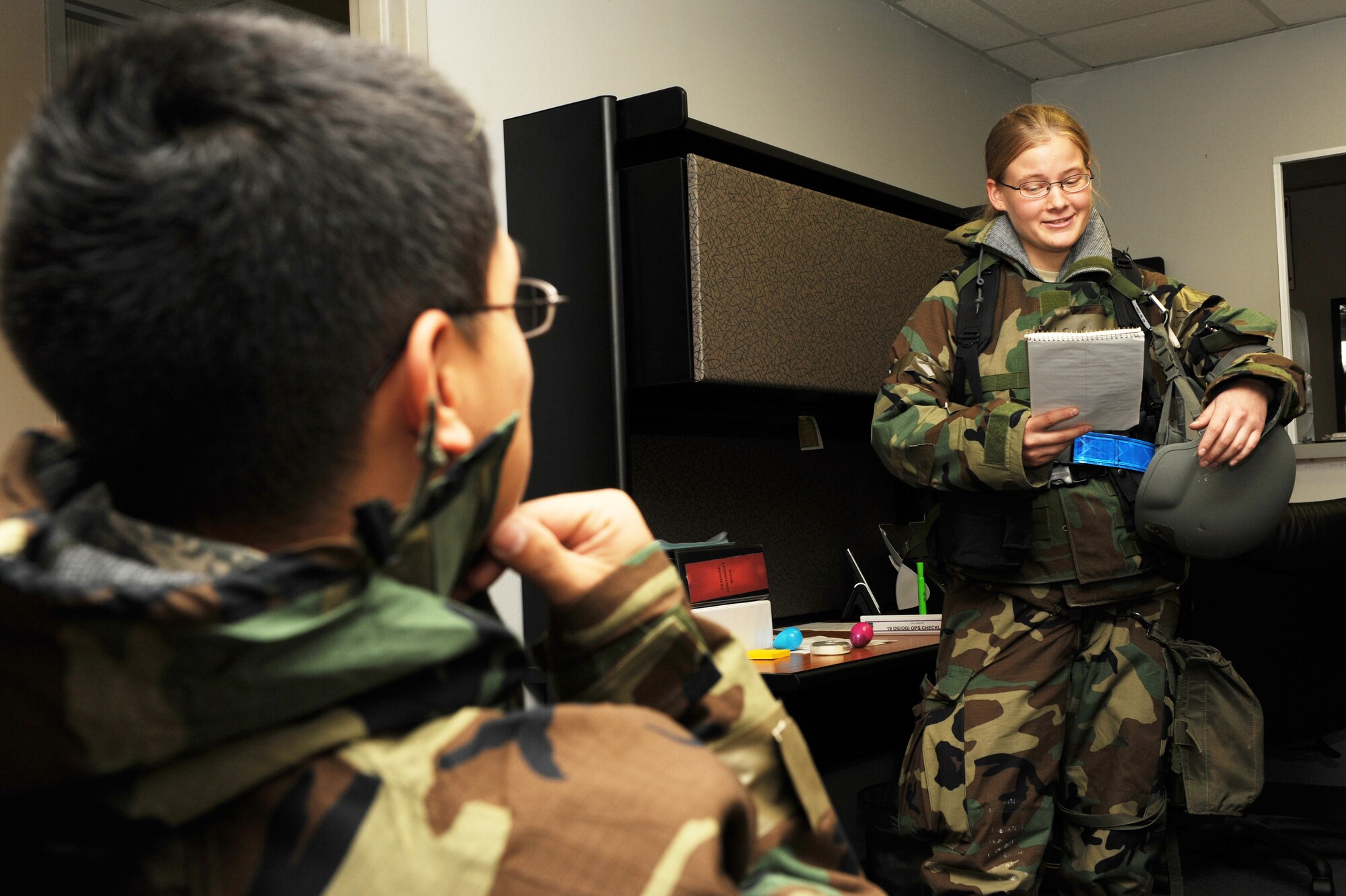 Airman 1st Class Shasta Sickinger, 19th Operations Group intelligence analyst, performs an intelligence brief on base Nov. 17. Airman Sickinger authored squadron continuity checklist that decreased 50 percent of turnover for home station pre-deployment training. (US Air Force photo by Senior Airman Jim Araos)