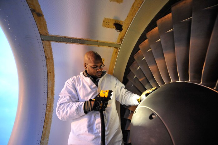 Senior Airman Reginald Camp inspects the inlet and exhaust of a C-17 engine on the flightline here Nov.13. Flightline maintenance tasks primarily include daily aircraft launch and recovery, pre- and post-flight inspections on aircraft and their engines, maintenance troubleshooting, aircraft systems repair and minor modifications. Airman Camp is a jet propulsion specialist with 437th Aircraft Maintenance Squadron. (U.S. Air Force photo/James Bowman)