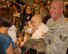 SSgt Steffan Smith holds one of his twins.  He was deployed for 8 months to Southwest Asia right after his twins were born. He deployed with the 184 SFS and returned on November 16, 2009 at McConnell AFB, KS.