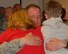 Maj Joe Dessenberger gets a big hug from his family.  He led the 184 SFS while they were deployed to Southwest Asia for 8 months and returned on November 16, 2009 at McConnell AFB, KS.