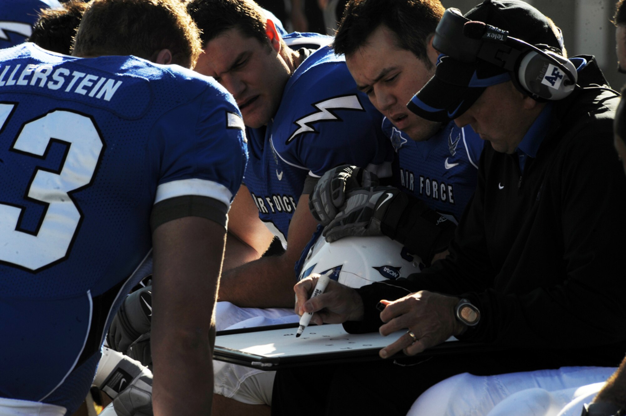 Members of the Air Force defense look as defensive coach draws out coverage assignments, Nov. 7. An Air Force win would make the team bowl eligible for the third consecutive season. (U.S. Air Force photo/Airman 1st Class Adam Grant)