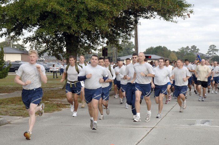 Team Charleston members pace themselves at the start of the Run the Runway 5K event honoring retired Brig. Gen. Thomas Mikolajcik here on Wingman Day Nov. 17. More than 800 Team Charleston members participated in the run which lead through part of the base and onto the runway. (U.S. Air Force photo/Staff Sgt. Marie Brown)