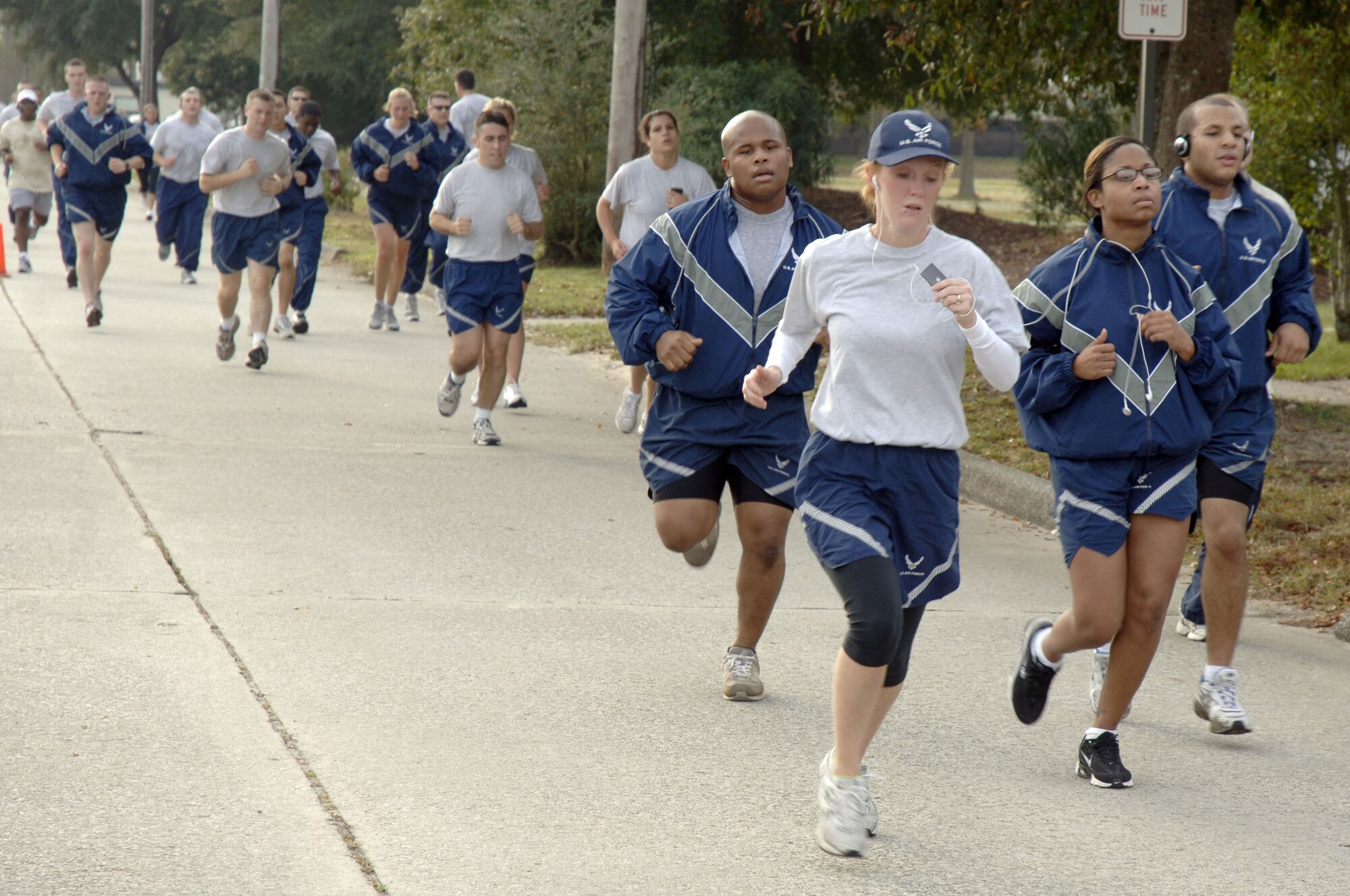 Team Charleston members approach the finish line during the Run the Runway 5K event honoring retired Brig. Gen. Thomas Mikolajcik here on Wingman Day Nov. 17. More than 800 Team Charleston members participated in the run which lead through part of the base and onto the runway. (U.S. Air Force photo/Staff Sgt. Marie Brown)