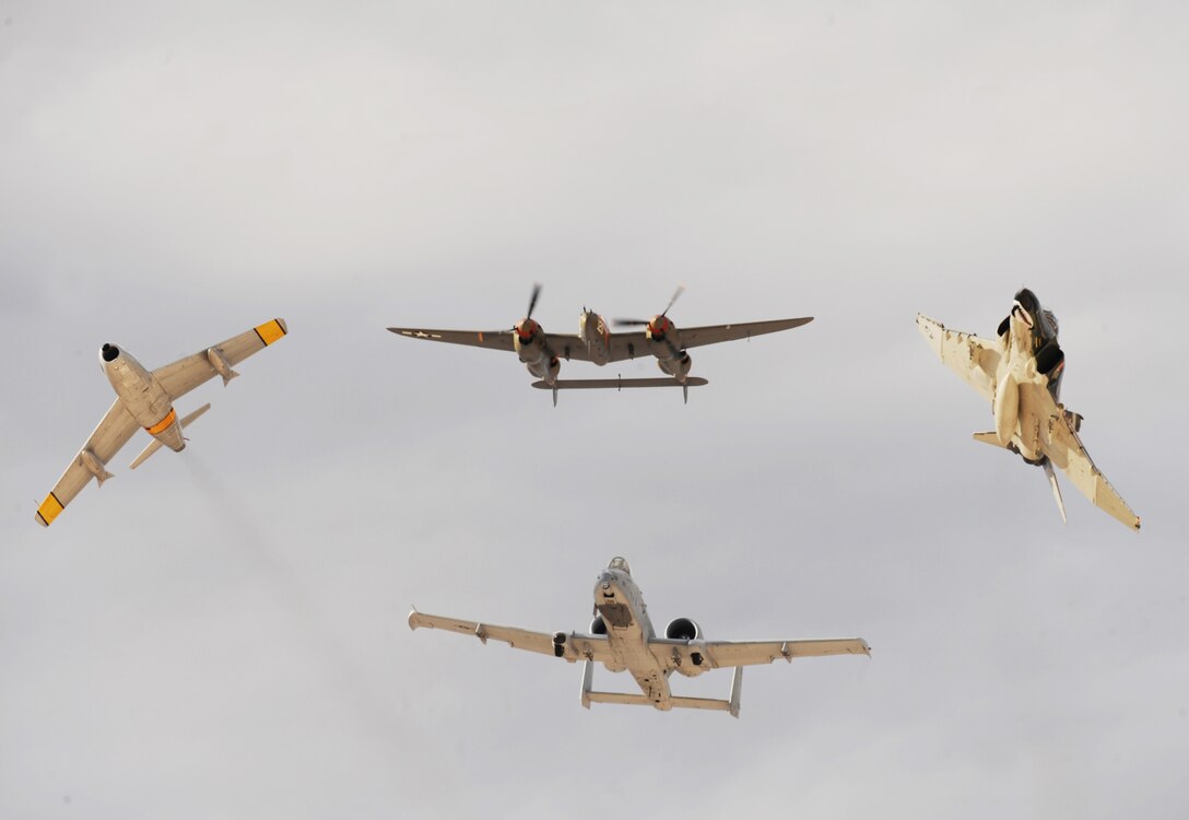 A F-86 Sabre, P-38 Lightning, F-4 Phantom and A-10 Thunderbolt (clockwise) break over Nellis Air Force Base, Nev., for the Air Combat Command heritage flight during the 2009 Aviation Nation open house Nov. 13, 2009. The open house is an opportunity for the Las Vegas community to view aerial demonstrations and static displays of various aircraft from the military. The open house also acts as the final air show of the year for the U.S. Air Force Aerial Demonstration Squadron Thunderbirds. (U.S. Air Force photo/Master Sgt. Kevin J. Gruenwald) 