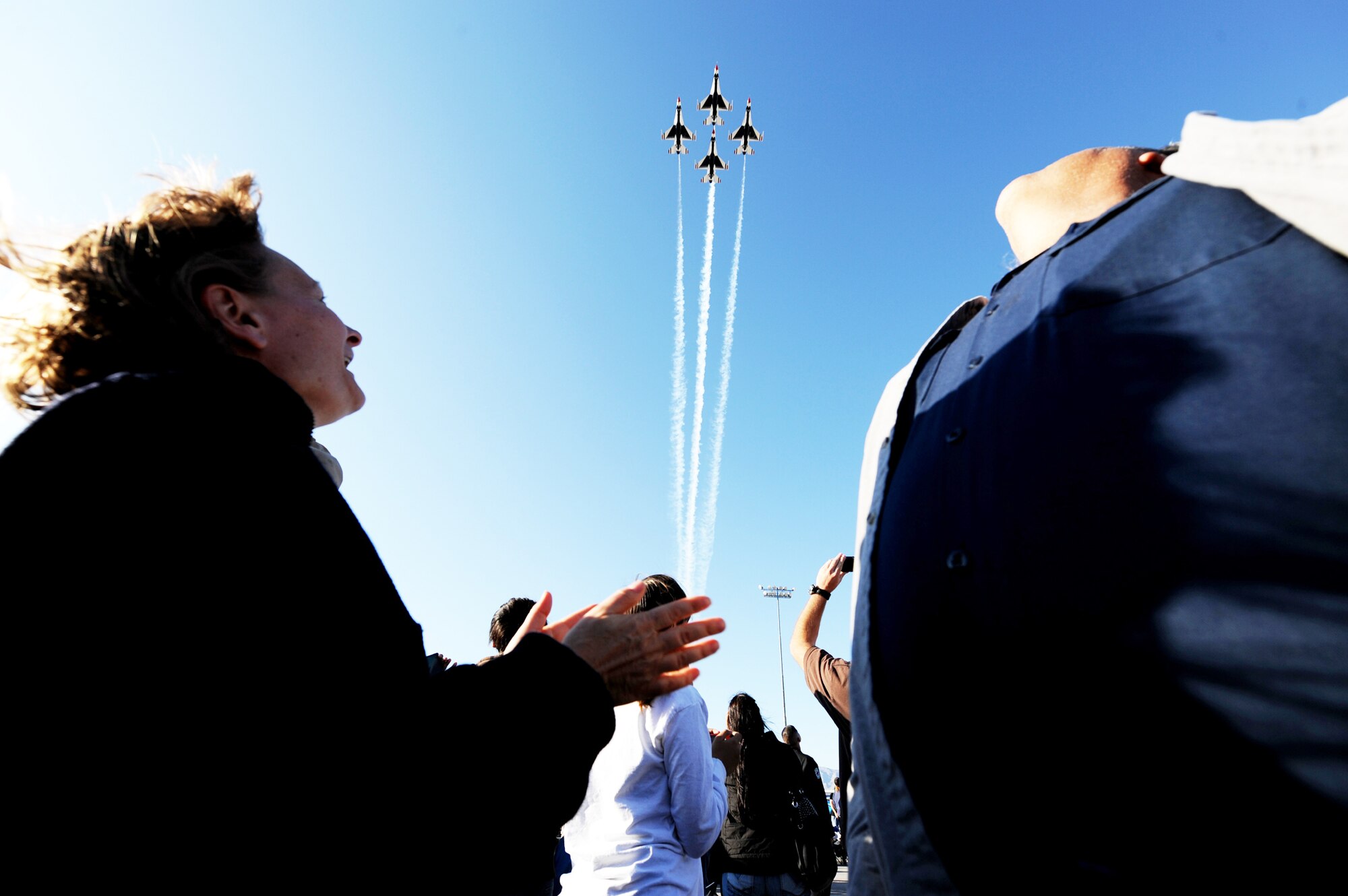 The U.S. Air Force Air Demonstration Squadron Thunderbirds fly over the audience during the Nellis Air Force Base, Nev., air show Nov. 14, 2009. The open house acts as the final air show of the year for the Thunderbirds. (U.S. Air Force photo/Airman 1st Class Brett Clashman)