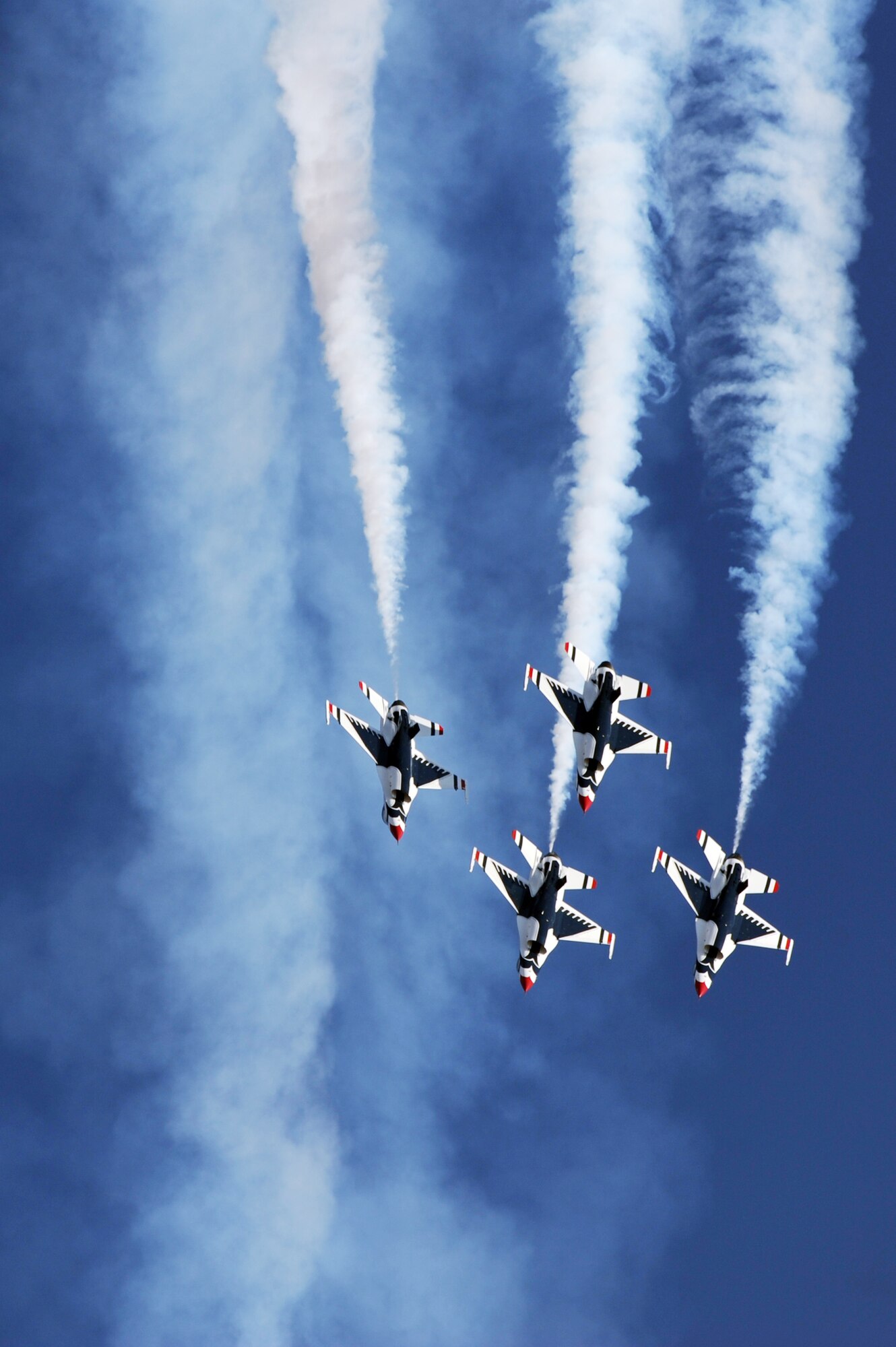 F-16s with the U.S. Air Force Air Demonstration Team Thunderbirds fly the arrowhead loop Nov. 13, 2009, during the 2009 Aviation Nation Nellis Air Force Base, Nev., open house. The open house is an opportunity for the Las Vegas community to view aerial demonstrations and static displays of various aircraft from the military. (U.S. Air Force photo/Tech. Sgt. Michael R. Holzworth)
