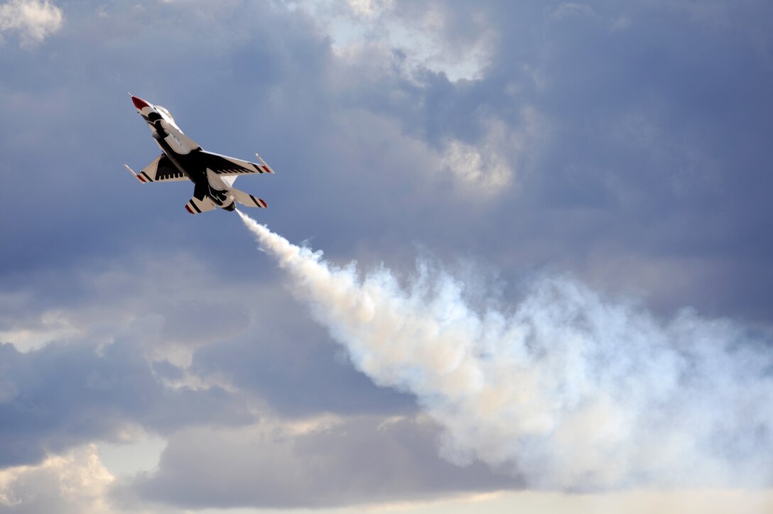 A U.S. Air Force Air Demonstration Team "Thunderbird," F-16 flies a high angle of attack maneuver at the air show over Nellis Air Force Base, Nev., Nov. 13, 2009.  The open house is the final air show of the year for the Thunderbirds. (U.S. Air Force photo/Tech. Sgt. Michael R. Holzworth)