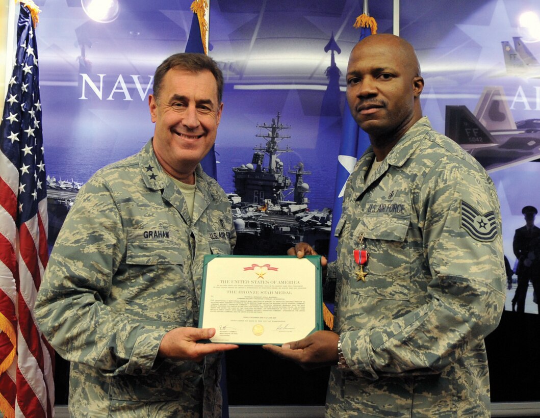 Technical Sgt. John A. Marshall, 779th Medical Operations Squadron medical technician, was presented the Bronze Star Medal by Maj. Gen. Gar Graham, 79th Medical Wing commander, at Joint Base Andrews Nov. 4. Sergeant Marshall received this honor for meritorious service while deployed in support of Operation ENDURING FREEDOM when his actions under fire saved the lives of two coalition Soldiers while serving under the Combined Security Transition Command. (U.S. Air Force photo/ Staff Sgt. Renae Kleckner)