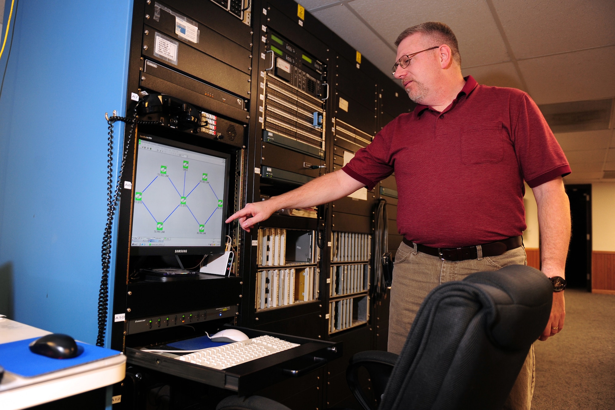 OFFUTT AIR FORCE BASE, Neb. - Dave Clingerman, a telecommunications specialist with the 55th Strategic Communications Squadron, explains how monitors the antennas for the Elkhorn and Scribner Communication Sites Nov. 5 from a detached facility located near Elkhorn, Neb. The communication sites support a wide variety of missions from executive levels of government to the National Aeronautics and Space Administration. U.S. Air Force photo by Josh Plueger
