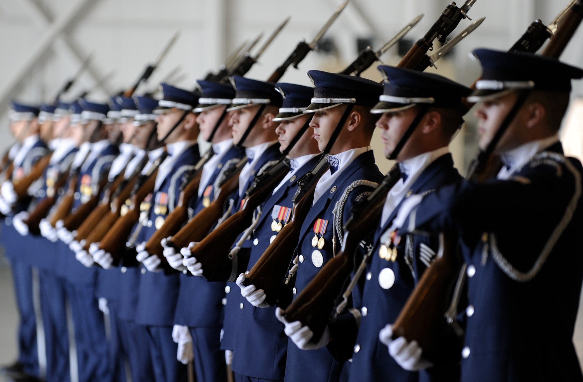 The Air Force Honor Guard Drill Team performes in Hangar 1823, Joint Base McGuire-Dix-Lakehurst, Nov.16. The drill team personifies the integrity, discipline, teamwork and professionalism of every Airman and every Air Force mission. (U.S. Air Force Photo/Carlos Cintron)
