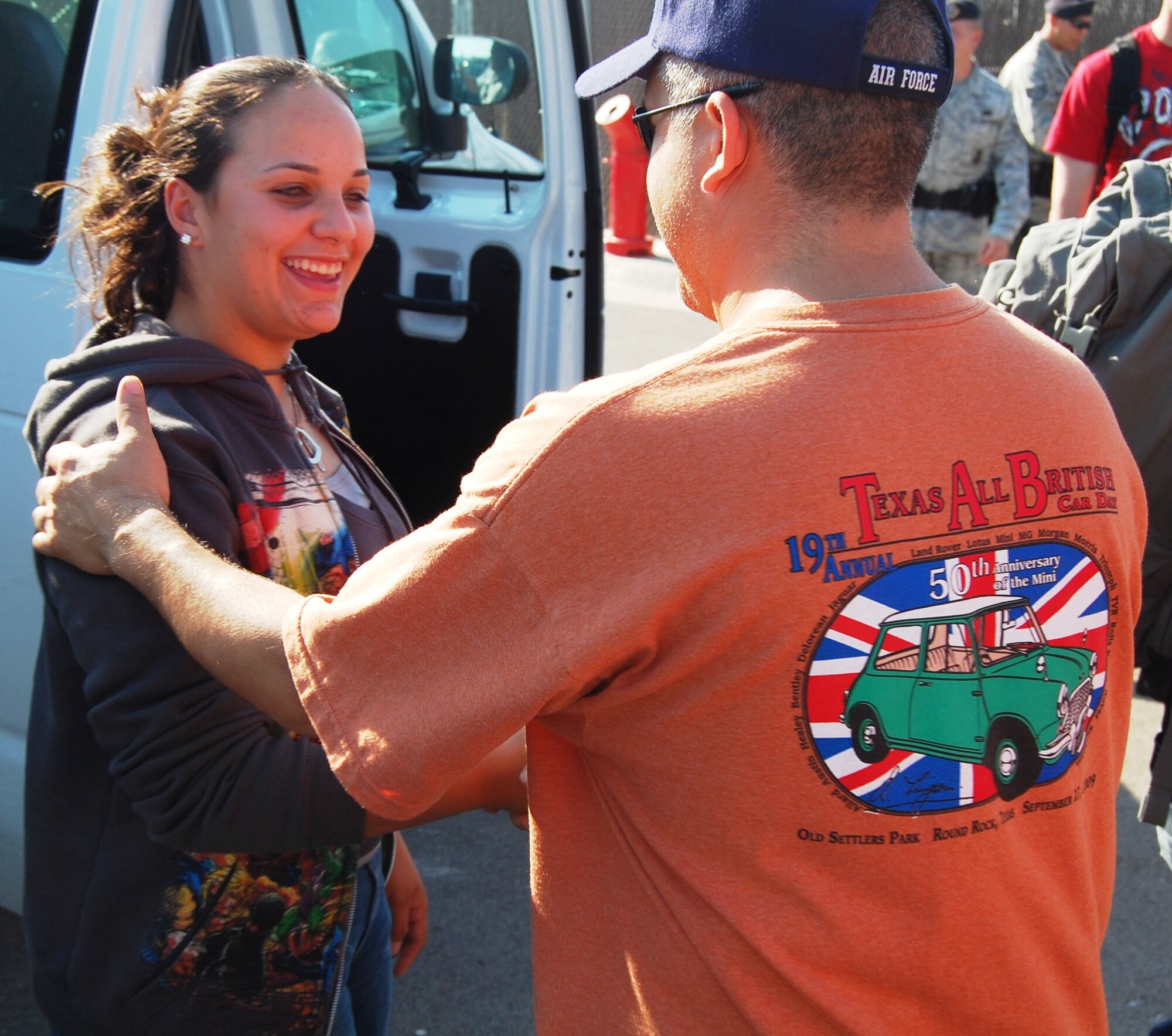 Airman 1st Class Marisel Kigembe, 47th Security Forces Squadron, is welcomed by Master Sgt. Darryl Rios-Maldonado, 47th SFS first sergeant, after returning from a deployment to Al Udeid Air Base in Southwest Asia where she performed base security. (U.S. Air Force photo by Joel Langton)