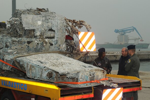 Maj. Shawna Kimbrell and 1st Lt. Justin Cleveland, F-16 fighter pilots from Aviano Air Base, Italy talk with Sergio Maron, an Italian aviation enthusiast, about the World War II Army Air Force fighter wreckage found in the Adriatic Sea during a ceremony at the Chioggia Lagoon Nov. 14, 2009.  The wreckage, believed to be a P-47 Thunderbolt that crashed into the Adriatic in the mid-1940’s, was recovered during a fishing expedition in May 2009.  (U.S. Air Force photo/Airman LaVel D. Sterling)