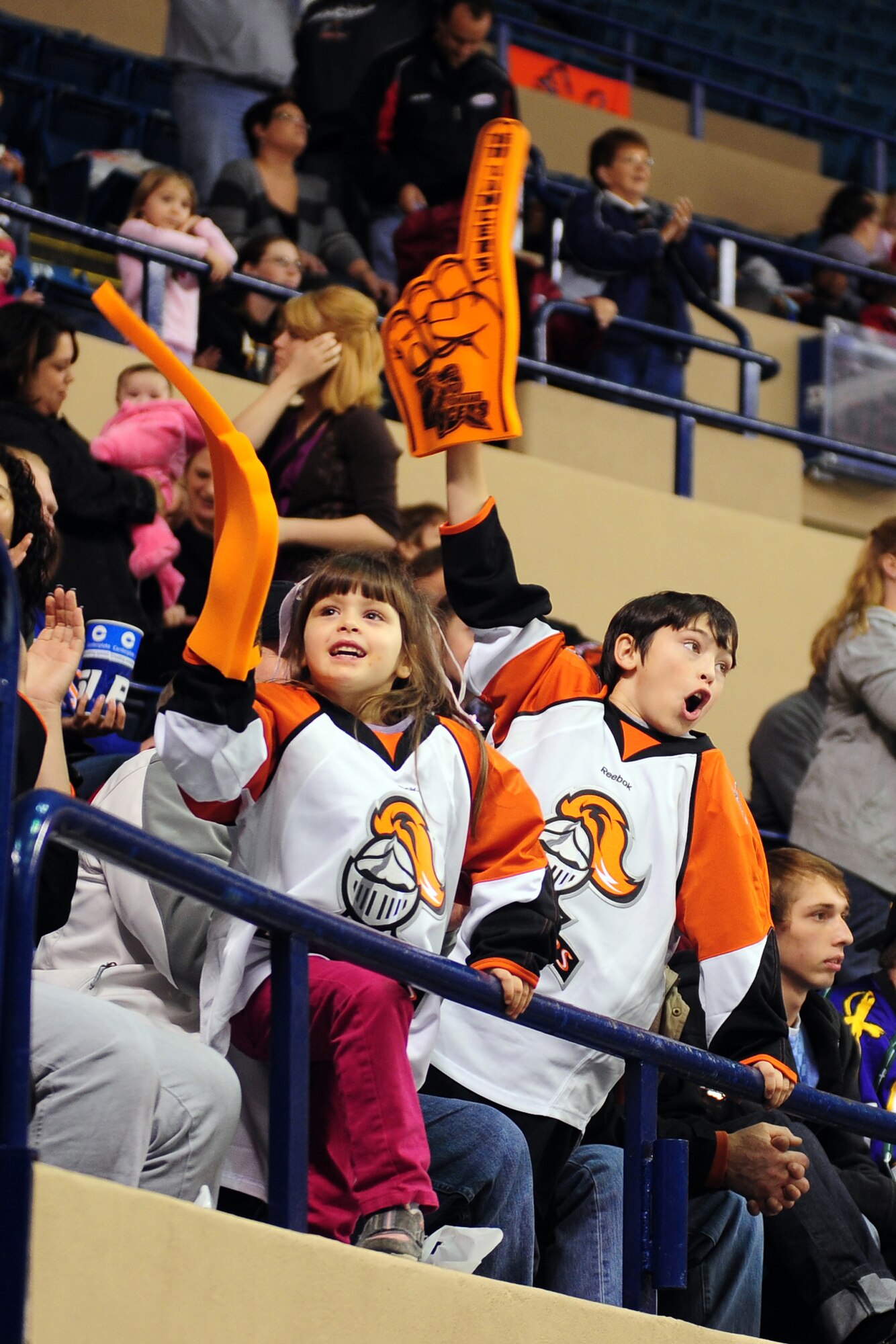 OFFUTT AIR FORCE BASE, Neb. - Ten-year-old Garrit Harrold and his 5-year-old sister Corinne, children of Heath Harrold, Language Learning Center director and prior Air Force veteran, cheer on the Omaha Lancers during the team's annual military appreciation game Nov. 13 at the Civic Auditorium in Omaha, Neb. Throughout the week of Veterans Day numerous organizations paid tribute to America's veterans. U.S. Air Force photo by Josh Plueger
