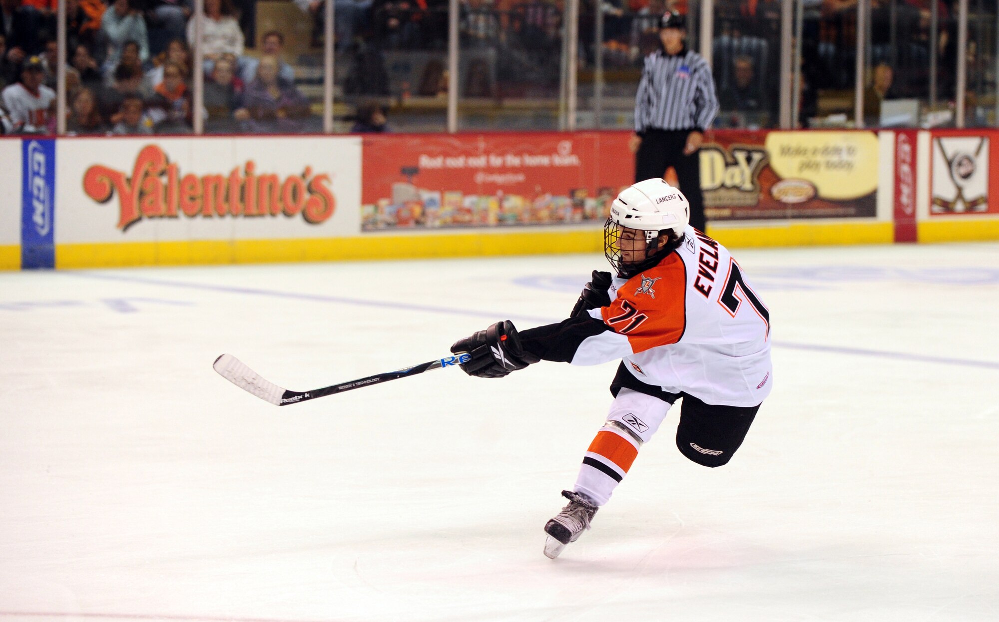 OFFUTT AIR FORCE BASE, Neb. - Dakota Eveland, center for the Omaha Lancers, takes a shot at the goal as his team played the Sioux City Musketeers at the Civic Auditorium in Omaha, Neb., Nov. 13, during the Lancers military apprecation game.  Throughout the week of Veterans Day numerous organizations paid special tribute to the men and women of America's armed forces. U.S. Air Force photo by Josh Plueger
