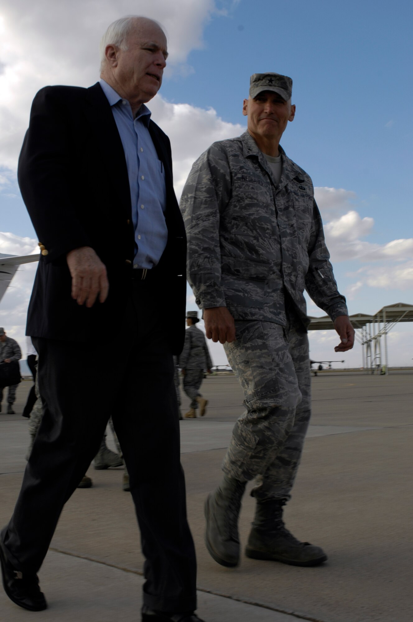 U.S. Senator John McCain and Brig. Gen. Kurt Neubauer, 56th Fighter Wing Commander, walk into the Base Operations building at Luke Air Force Base, Arizona, Nov 13, 2009. Sen. McCain visited Luke and held a press conference to discuss the future of the base and his support of it.(U.S. Air Force Photo by Staff Sgt. Jason Colbert)