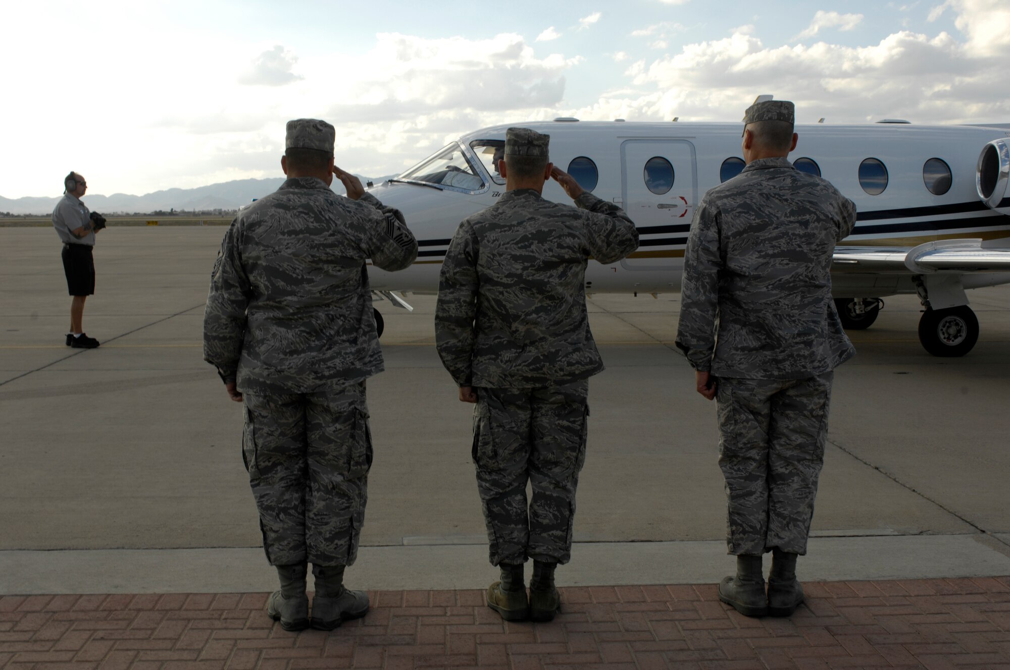 Top leaders from the 56th Fighter Wing salute the arrival of U.S. Senator John McCain on the flightline at Luke Air Force Base, Arizona, Nov 13, 2009. Sen. McCain visited Luke and held a press conference to discuss the future of the base and his support of it.(U.S. Air Force Photo by Staff Sgt. Jason Colbert)