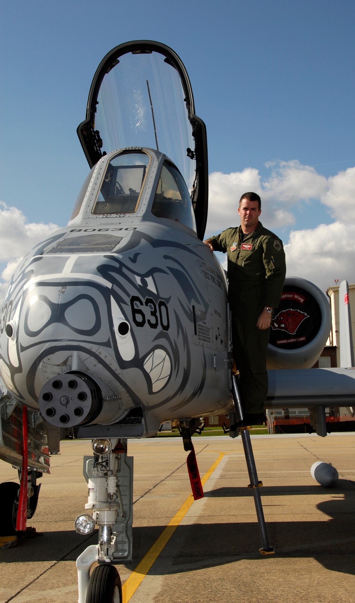 Maj. Jay Spohn, an A-10 Thunderbolt II "Warthog" pilot with the 188th Fighter Wing Arkansas Air National Guard, based in Fort Smith, Ark., poses on the ladder of an A-10 during a photo shoot following a press conference held at the 188th Nov. 10, 2009. Spohn was the only Air National Guard pilot to be selected to fly the F-35 Lightning II Joint Strike Fighter in the program's initial cadre. (U.S. Air Force photo by Senior Master Sgt. Dennis Brambl/188th Fighter Wing Public Affairs)