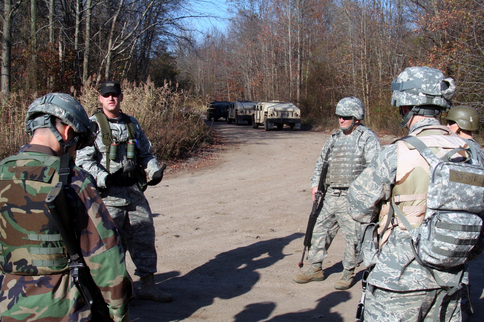 Tech. Sgt. John Gray (left-center), combat skills instructor, provides a briefing to students in the Combat Airman Skills Training Course 10-1A during mounted patrol operations, or convoy, training in the course on Nov. 8, 2009, at Joint Base McGuire-Dix-Lakehurst, N.J.  The course, taught by the U.S. Air Force Expeditionary Center's 421st Combat Training Squadron, prepare Airmen for upcoming deployments.  (U.S. Air Force Photo/Tech. Sgt. Scott T. Sturkol)