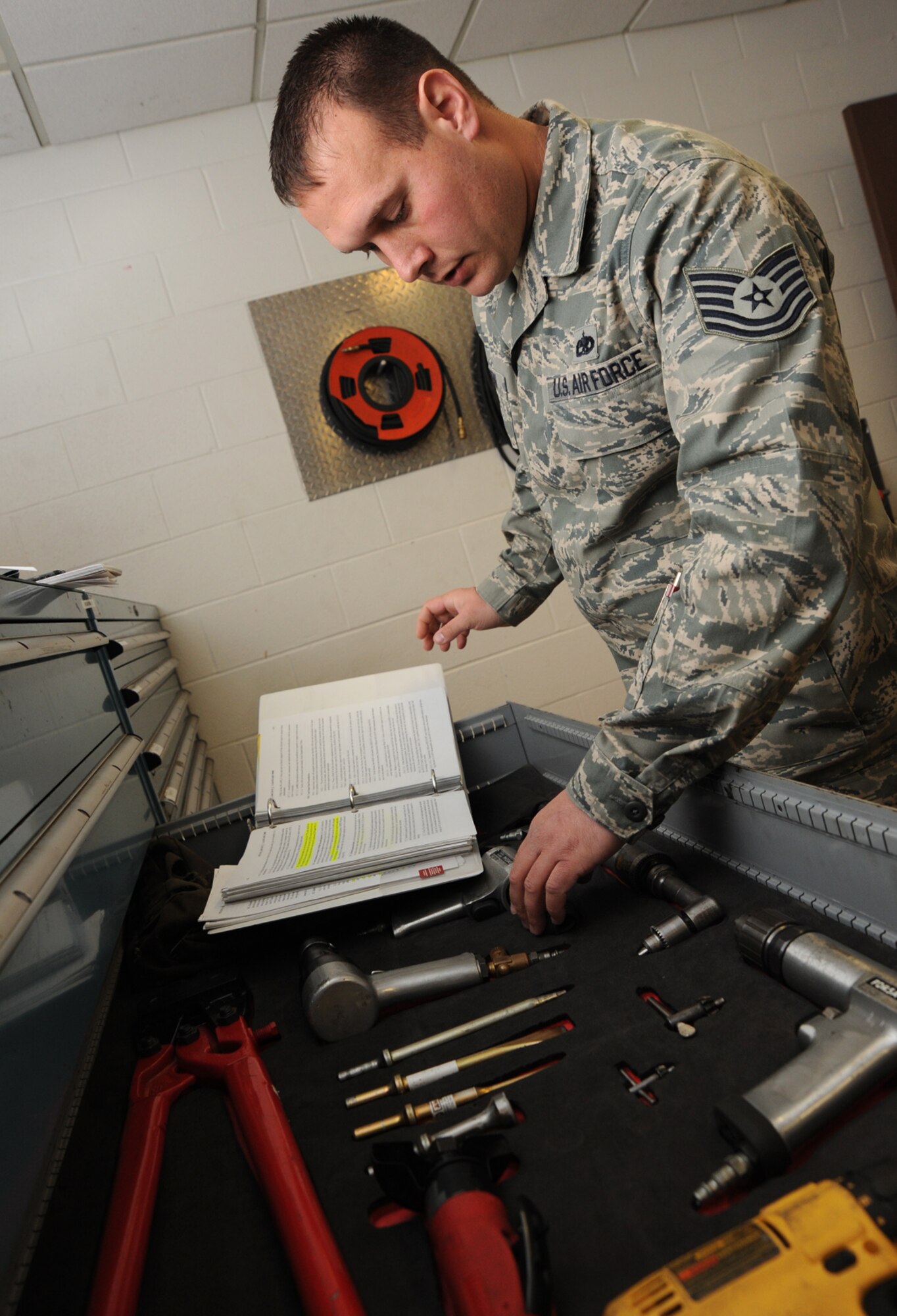 Tech. Sgt. Joe Healy inspects the quality and accountability of tools and equipment in a maintenance shop at the 22nd Maintenance Squadron Nov. 16, 2009 at McConnell Air Force Base, Kan. The Mascoutah, Ill., native is a production superintendant for the 22nd MXS (U.S. Air Force photo/Senior Airman Jessica Lockoski) 