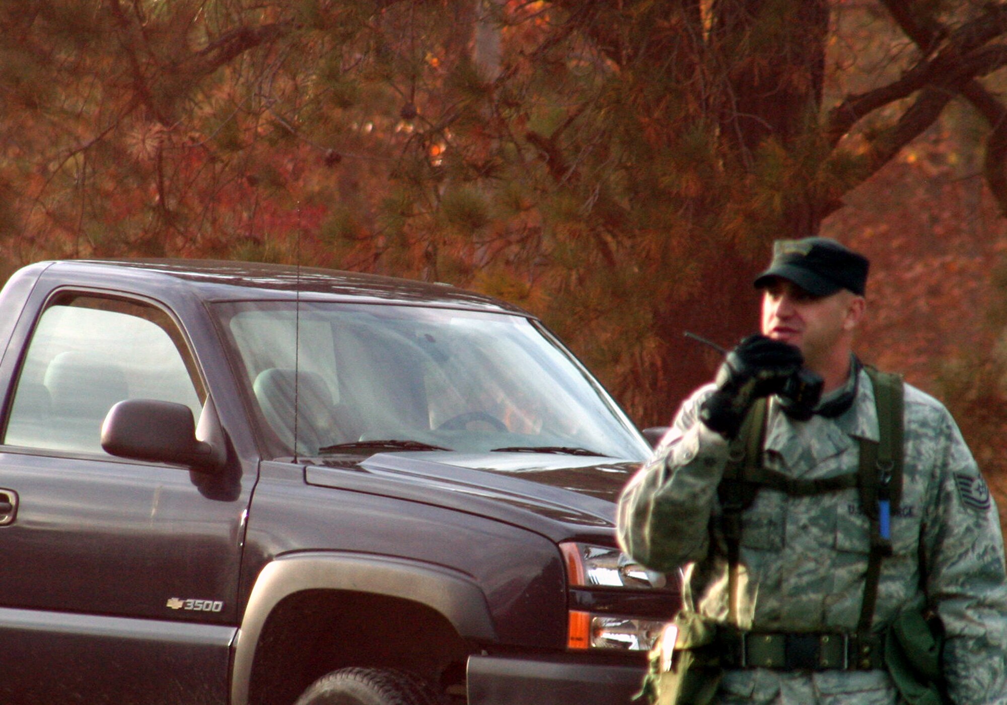 Tech. Sgt. John Gray, combat skills instructor, talks on his radio while training students in the Combat Airman Skills Training Course 10-1A during tactics training in the course on Nov. 4, 2009, at Joint Base McGuire-Dix-Lakehurst, N.J.  The course, taught by the U.S. Air Force Expeditionary Center's 421st Combat Training Squadron, prepare Airmen for upcoming deployments.  (U.S. Air Force Photo/Tech. Sgt. Scott T. Sturkol)