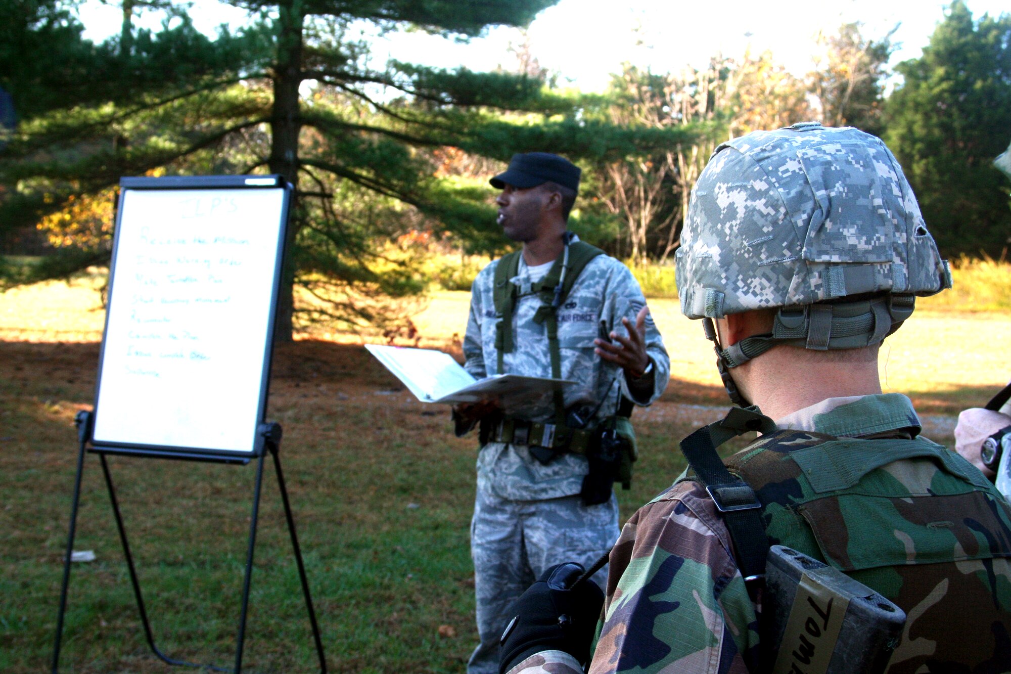 Tech. Sgt. Terry Bean, combat skills instructor, provides a briefing to students in the Combat Airman Skills Training Course 10-1A during tactics training in the course on Nov. 4, 2009, at Joint Base McGuire-Dix-Lakehurst, N.J.  The course, taught by the U.S. Air Force Expeditionary Center's 421st Combat Training Squadron, prepare Airmen for upcoming deployments.  (U.S. Air Force Photo/Tech. Sgt. Scott T. Sturkol)