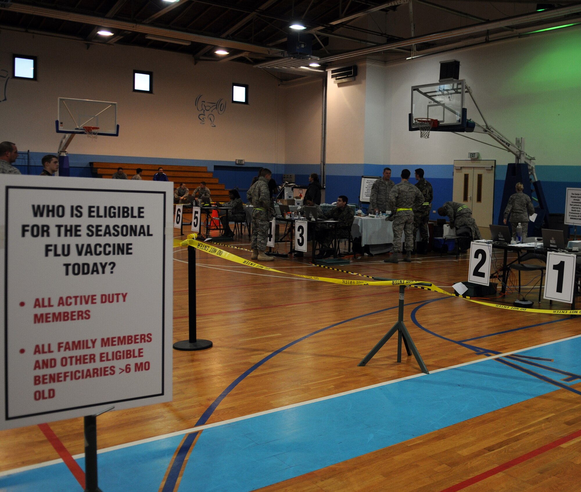 Booths are set up for the administration of the H1N1 vaccine at the Southside Gym Annex Ramstein Air Base, Germany, Nov. 17, 2009. The H1N1 vaccine is being given to military members and their families to help fight against influenza around the Kaiserslautern Military Community. All patients with flu like symptoms who come to the medical facility are expected to wear a mask while in the facility.  Masks are available at the entrance to the clinic. (U.S. Air Force photo by Airman 1st Class Caleb Pierce)