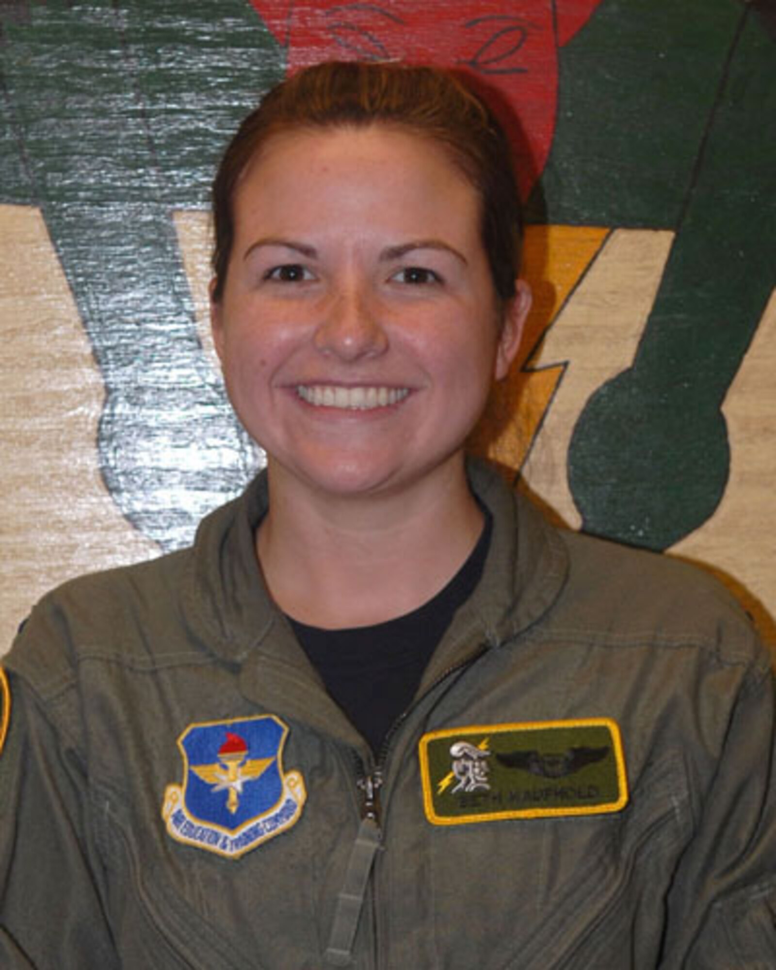 First Lt. Beth Kaufhold  graduated the Introduction to Fighter Fundamentals course Nov. 17. She will be a weapon systems officer on the F-15E. (U.S. Air Force photo). 
