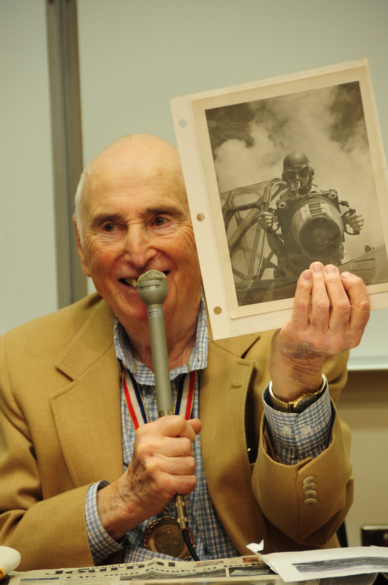 ELLSWORTH AFB, S.D.-- Stan Lieberman, survivor from the attack on Pearl Harbor, December 7, 1941, talks about what it was like during the attack while holding up an image of himself in the U.S. Army Air Corps, Nov 10.  Stan Lieberman joined the U.S. Army Air Corps in 1940 as an aerial photographer. (U.S. Air Force photo/Airman 1st Class Anthony Sanchelli)