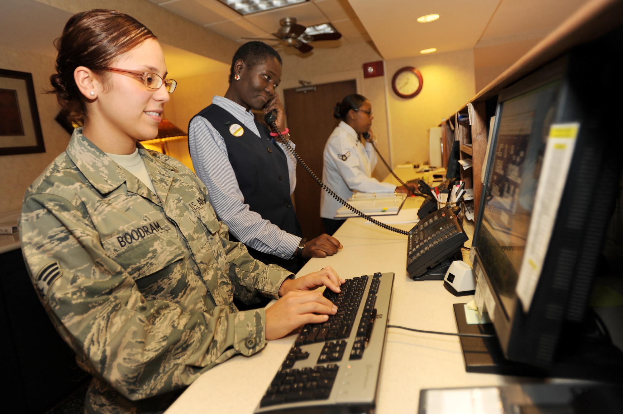Senior Airman Tatianna Boodram, Dora Kwarteng, and Airman 1st Class Mia Gerald-Myles, 19th Force Support Squadron guest service representatives, attend to customer needs at the Razorback Inn Nov. 12. The inn is centrally located on base and conveniently located close to Hangar 1080, the Deer Run Golf Course and the Bowling Center. (U.S. Air Force photo by Senior Airman Jim Araos)
