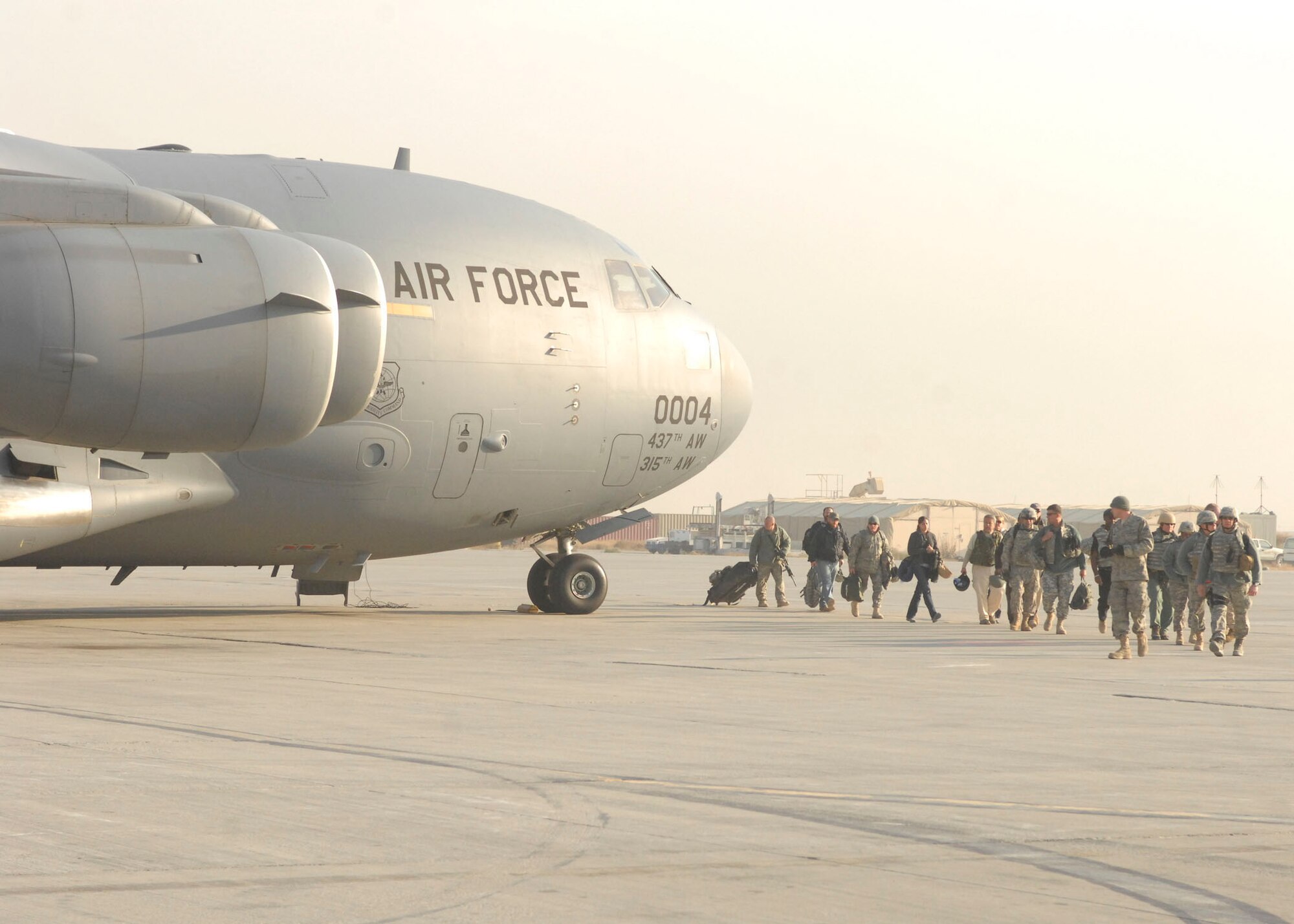 BAGRAM AIRFIELD, Afghanistan -- Troops disembark from a C-17 Globemaster III, Nov. 17, 2009. C-17's carry a maximum of 170,900 pounds, and can land on runways as short as 3,500 feet. (U.S. Air Force photo/Senior Airman Susan Tracy)