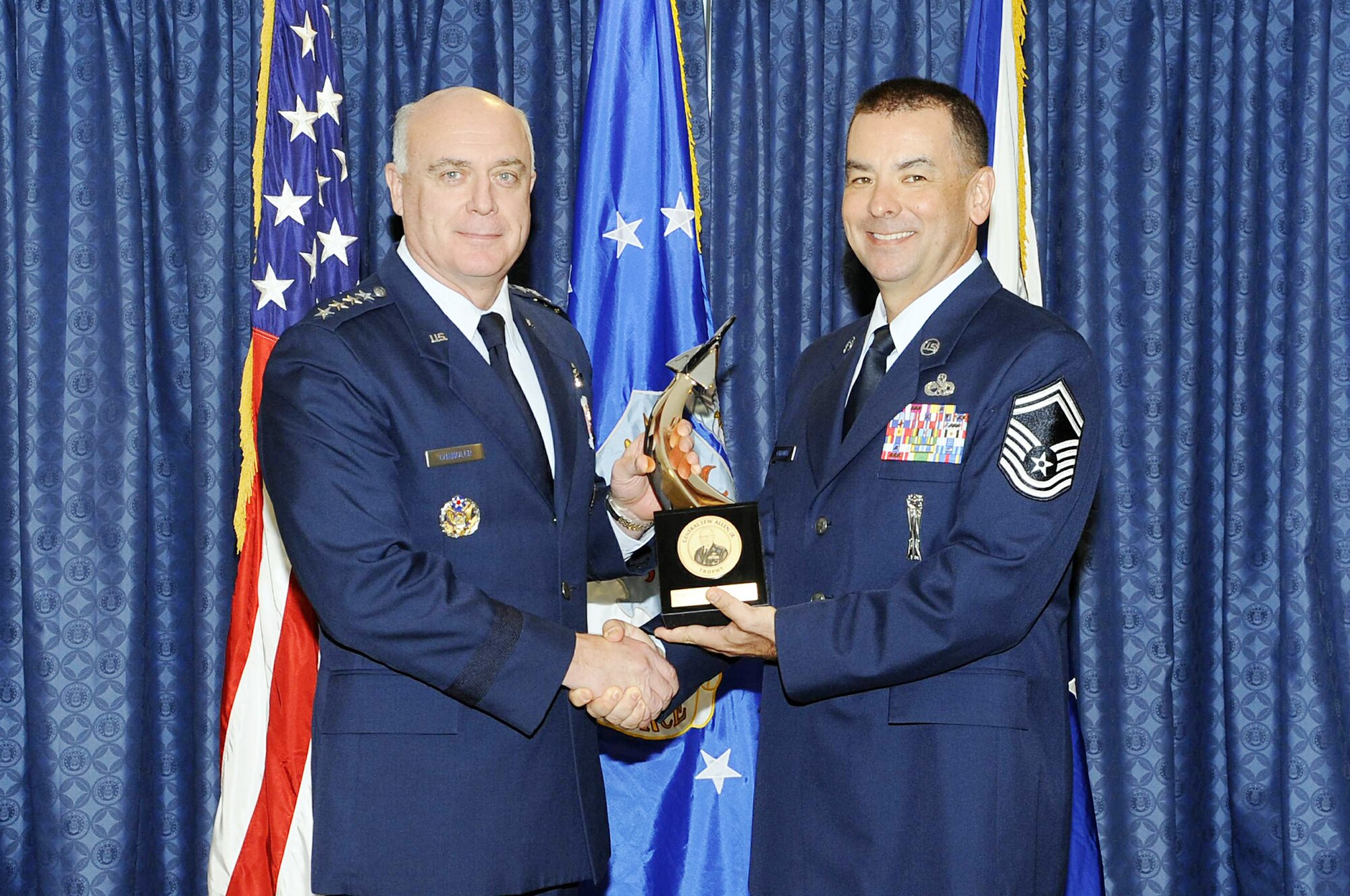 Gen. Carrol H. "Howie" Chandler presents the Gen. Lew Allen Jr. Award to Senior Master Sgt. Franklin A. Galloway Nov. 16, 2009, in the Airman's Hall of the Pentagon. General Chandler is the vice chief of staff of the Air Force. Sergeant Galloway is the superintendent of the 14th Aircraft Maintenance Unit at Misawa Air Base, Japan. (U.S. Air Force photo)
