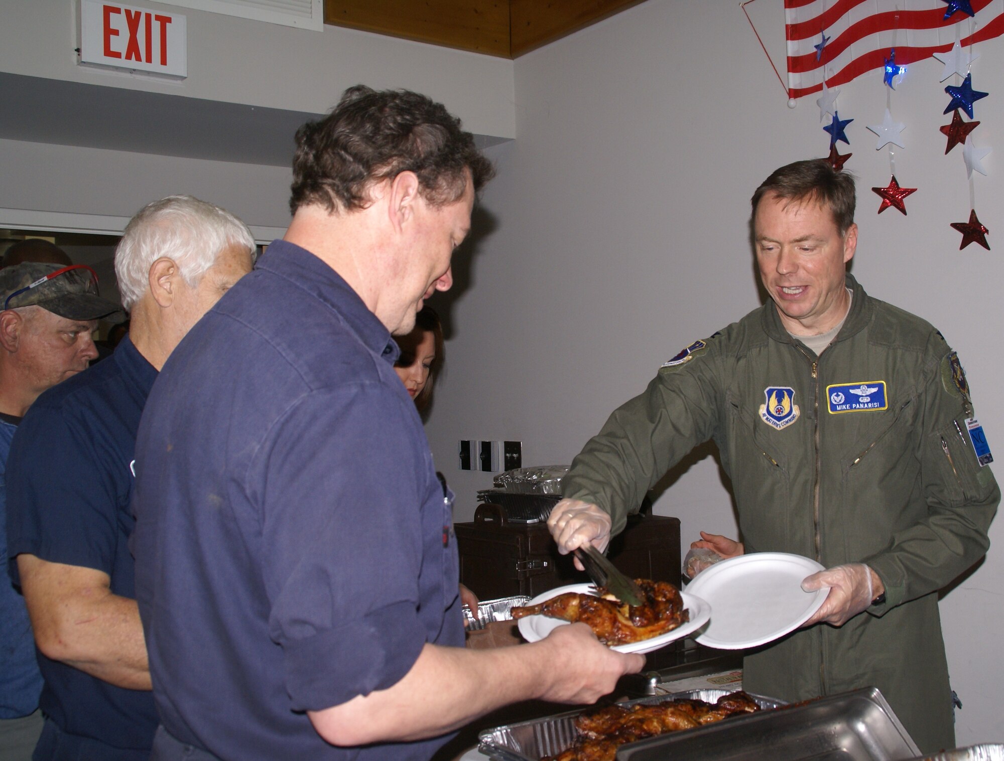 On Veteran’s Day, Arnold Engineering Development Center Commander Col. Michael Panarisi served chicken and ribs during a lunch honoring military veterans who work at the Bridgestone Firestone North American Tire’s Warren County truck tire manufacturing facility near Morrison, Tenn. The plant celebrated Veteran’s Day by serving a complimentary meal in four shifts to their 235 employees who are veterans. (Photo by Philip Lorenz III)