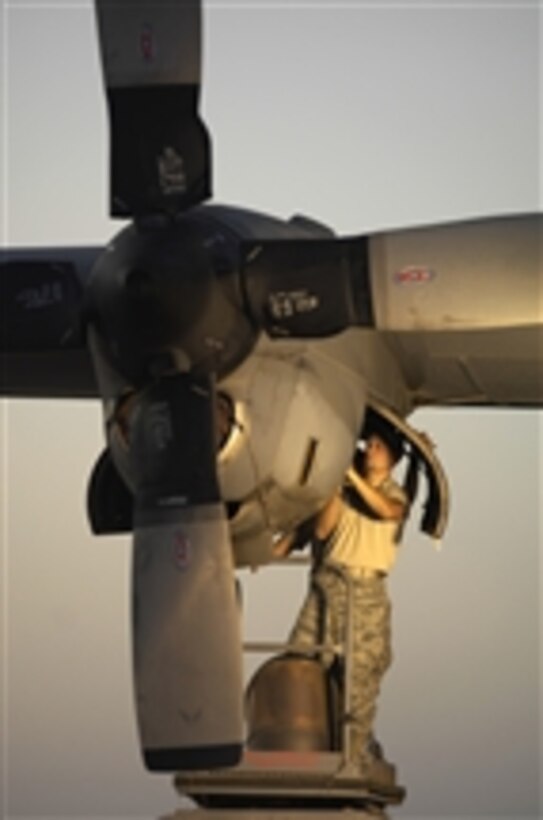 U.S. Air Force Tech. Sgt. Zachary Michalski, with the 164th Expeditionary Air Squadron, 25th Combat Air Battalion, uses a borescope to inspect a turbine on the engine of a C-130 Hercules cargo plane at Contingency Operating Base Speicher, Iraq, on Nov. 11, 2009.  