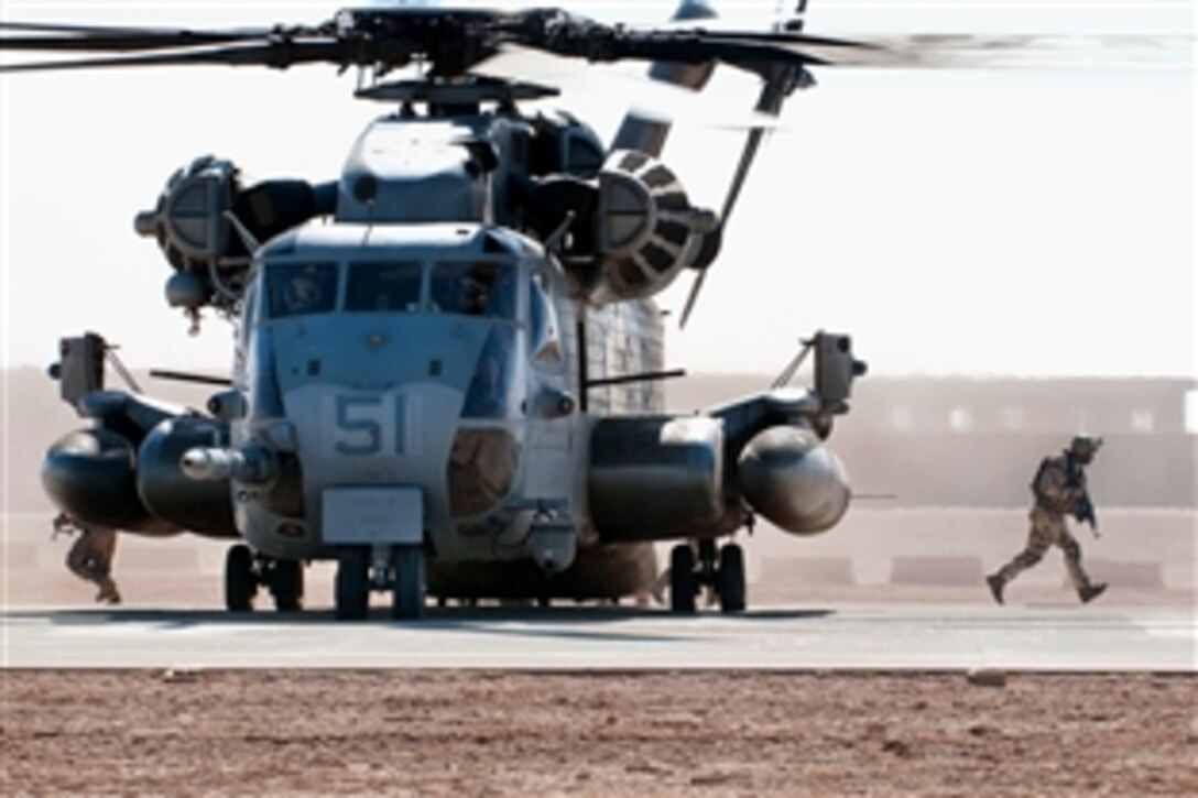 An Iraqi soldier exits a Marine helicopter during joint air assault training between Iraqi commandos and scouts, and U.S. Army paratroopers on Camp Ramadi, Iraq, Nov. 15, 2009. The goal of the training was to learn the standard procedures of each side for future joint missions. The U.S. soldiers are assigned to the 82nd Airborne Division's 2nd Battalion, 504th Parachute Infantry Regiment, which is serving as an Advise and Assist Brigade.