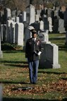 NEW YORK -- An Army soldier stands in the Cypress Hills National Cemetery waiting to play taps in honor of the formerly oldest living female Marine, Miriam Cohen, who was buried Nov. 17, here. The 101-year-old Cohen enlisted in the Marine Corps during World War II and again during the Korean War. She was the oldest female enlistee of her time at 35 years old and was part of the first female Marine recruit class. (Official Marine Corps photo by Sgt. Randall A. Clinton)