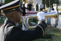 NEW YORK -- An Army soldier stands in the Cypress Hills National Cemetery playing taps in honor of the formerly oldest living female Marine, Miriam Cohen, who was buried Nov. 17, here. The 101-year-old Cohen enlisted in the Marine Corps during World War II and again during the Korean War. She was the oldest female enlistee of her time at 35 years old and was part of the first female Marine recruit class. (Official Marine Corps photo by Sgt. Randall A. Clinton)