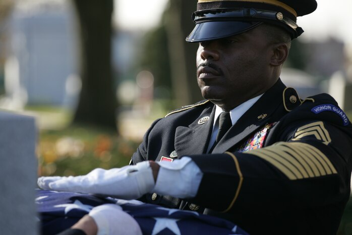 NEW YORK -- An Army soldier folds an American Flag over the casket of the formerly oldest living female Marine, Miriam Cohen, who was buried Nov. 17, in Cypress Hills National Cemetery. The 101-year-old Cohen enlisted in the Marine Corps during World War II and again during the Korean War. She was the oldest female enlistee of her time at 35 years old and was part of the first female Marine recruit class. (Official Marine Corps photo by Sgt. Randall A. Clinton)