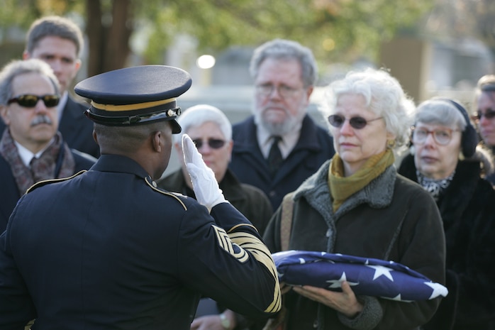NEW YORK -- Roberta Eaton, Marine veteran and part of the Women Marines Association, watches the grave-side ceremony for the formerly oldest living female Marine, Miriam Cohen, who was buried Nov. 17, in Cypress Hills National Cemetery. The 101-year-old Cohen enlisted in the Marine Corps during World War II and again during the Korean War. She was the oldest female enlistee of her time at 35 years old and was part of the first female Marine recruit class. (Official Marine Corps photo by Sgt. Randall A. Clinton)