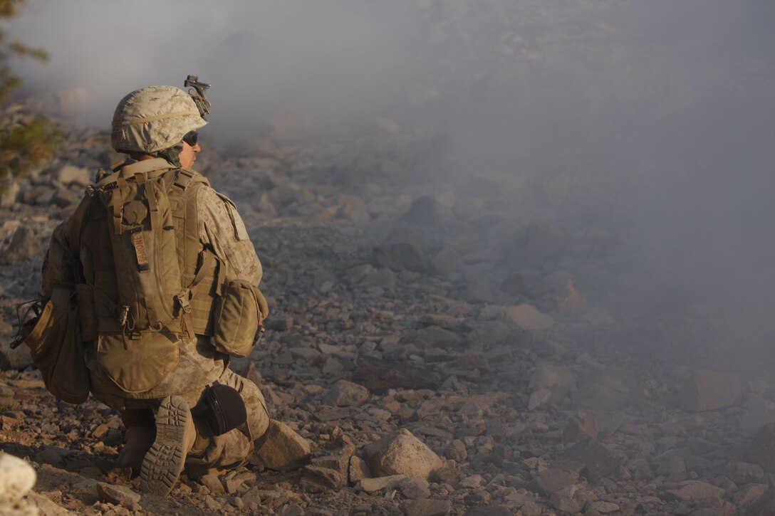Lance Cpl. Christopher Ryan Maroney, a rifleman with Company I, 3rd Battalion, 7th Marine Regiment, watches as a smoke rises from the Combat Center’s range 410A Nov. 19. The company culminated its platoon-level training at the range