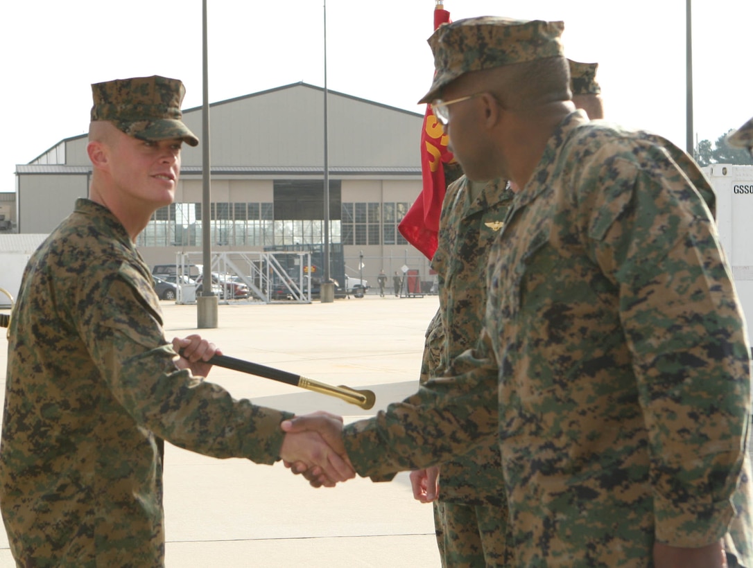 Sergeant Christopher Dunton, a forward looking infrared technician with Marine Aviation Logistics Squadron 31, shakes Sgt. Maj. Clarence Richardson, the Marine Aircraft Group 31 sergeant major, after his award ceremony for receiving Noncommissioned Officer of the Quarter for II Marine Air Wing on the Air Station, Nov. 18. Dunton was meritoriously promoted to sergeant after receiving the award, Nov. 2.