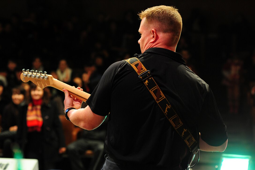 BISHKEK, Kyrgyzstan -- Tech. Sgt. Steve Wilson, U.S. Air Forces Central Sirocco Band guitarist, plays a riff during a performance at the Palace of Sport, Nov. 16, 2009. The band performs a wide variety of songs to include pop, rock, and oldies hits. Sirocco members are deployed from Lackland Air Force Base, Texas. (U.S. Air Force photo/Senior Airman Steele C. G. Britton)
