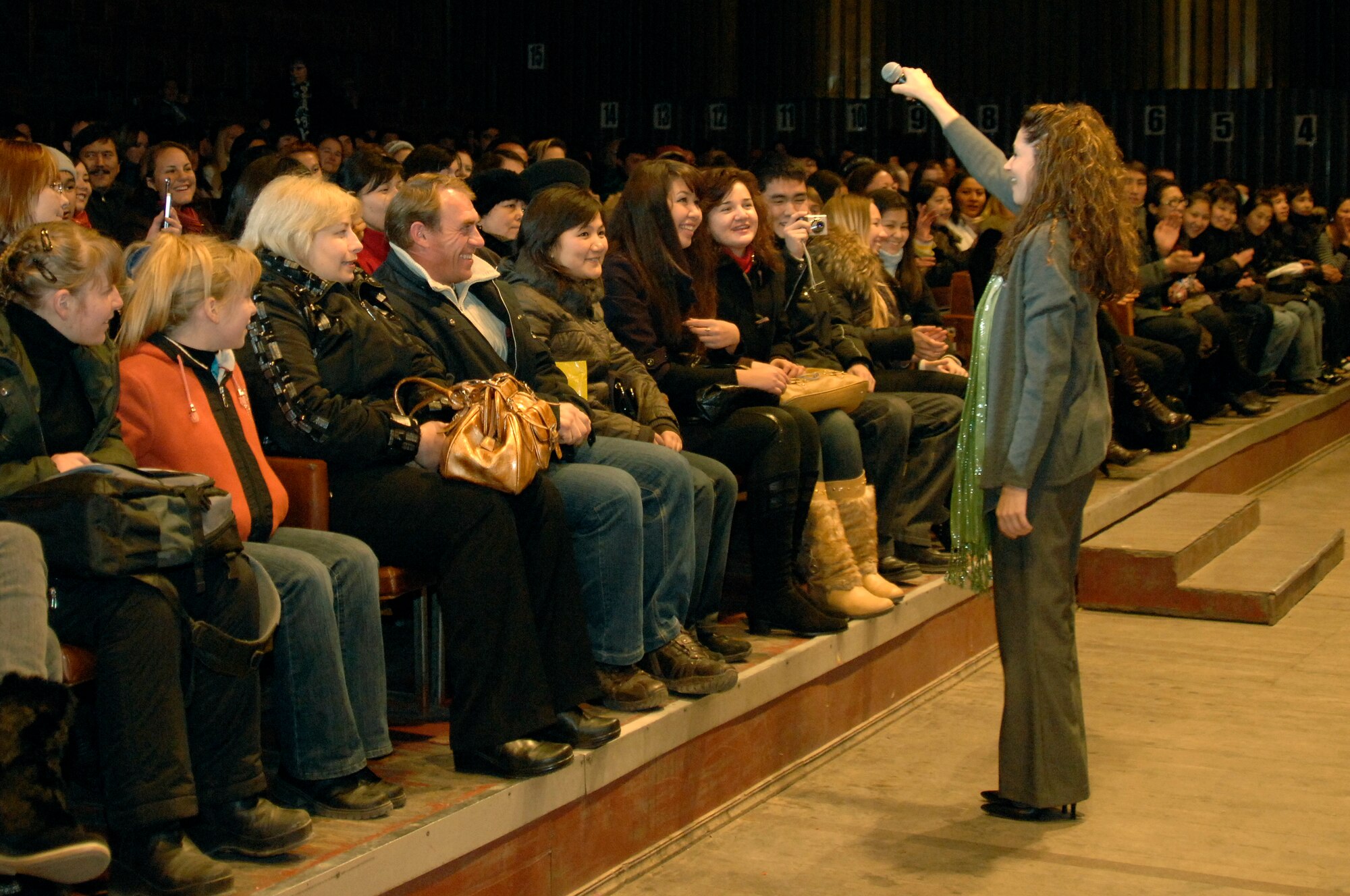BISHKEK, Kyrgyzstan -- Tech. Sgt. Christin Foley, U.S. Air Forces Central Sirocco Band vocalist, asks the audience to sing along during a performance at the Palace of Sport, Nov. 16, 2009. Sergeant Foley and the Sirocco Band are stationed at a base in Southwest Asia and are deployed from Lackland Air Force Base, Texas. (U.S. Air Force photo/Senior Master Sgt. Andrew E. Lynch)